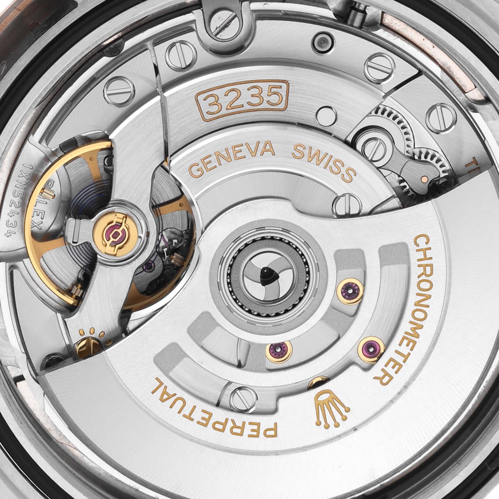 The image shows an overhead view of the Rolex Datejust 41 126331 Men's Steel and Gold (two tone) Pink Dial 126331 Men's Steel and Gold (two tone) Pink Dial's movement, highlighting the rotor and intricate gear details.