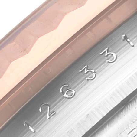 The image shows a close-up of the bezel and edge of the dial of a Rolex Datejust 41 126331 Men's Steel and Gold (two tone) Pink Dial 126331 Men's Steel and Gold (two tone) Pink Dial, highlighting the engraved numbers.