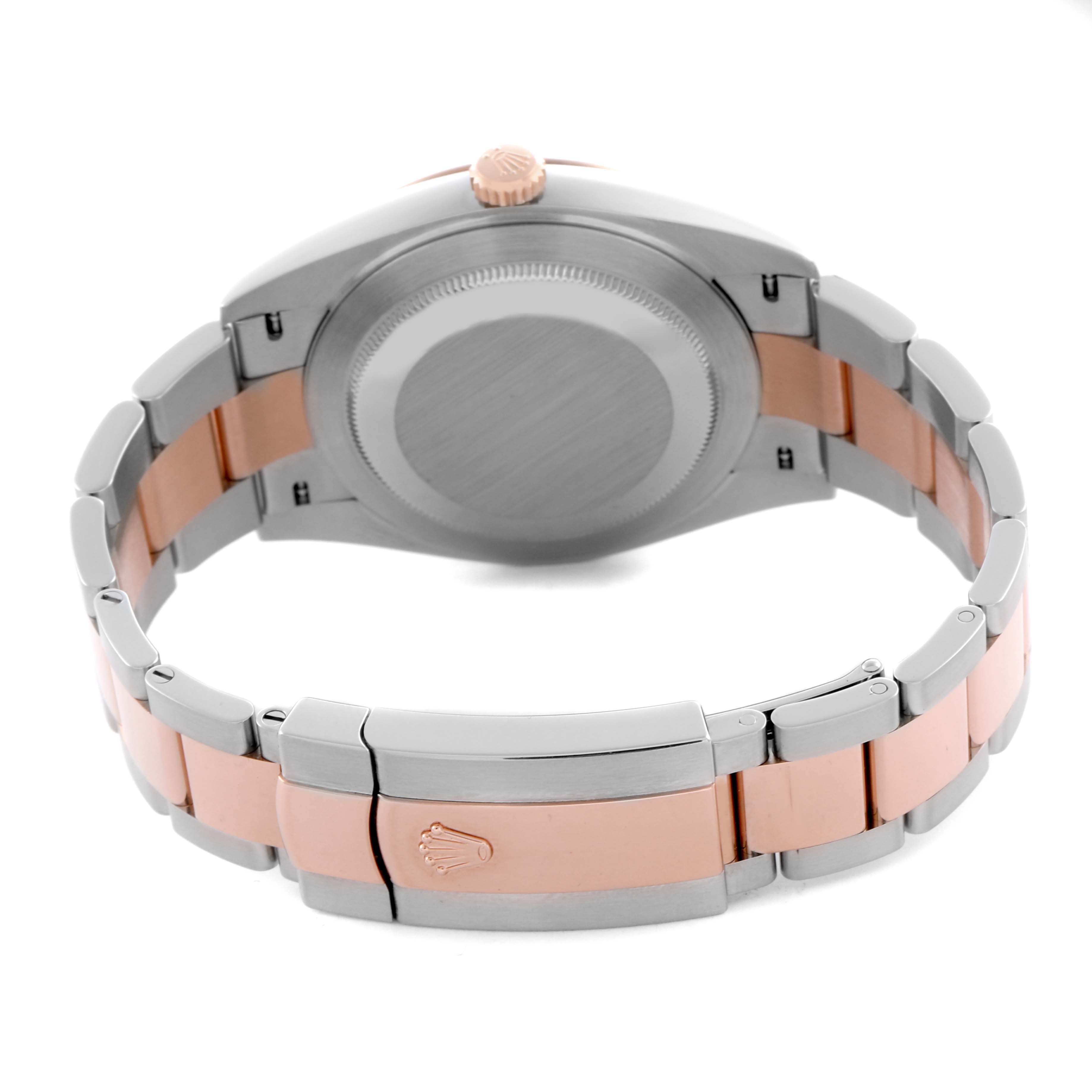 The Rolex Datejust 41 126331 Men's Steel and Gold (two tone) Pink Dial 126331 Men's Steel and Gold (two tone) Pink Dial is shown from the back, highlighting the case, crown, and two-tone bracelet.