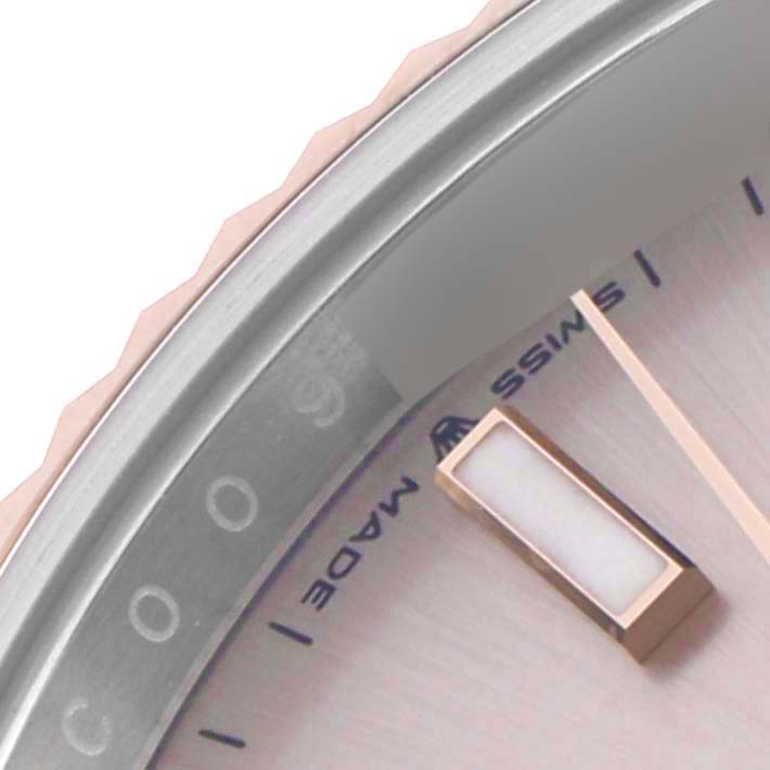 The image shows a close-up of the dial and bezel edge of a Rolex Datejust 41 126331 Men's Steel and Gold (two tone) Pink Dial, highlighting the markers and text.