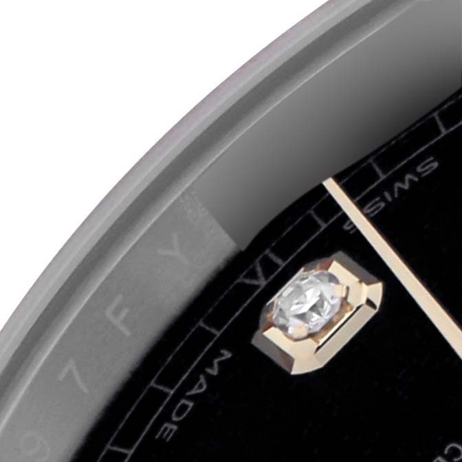 The image shows a close-up of the Rolex Datejust 41 126333 Men
s Steel and Gold (two tone) Black Dial 126333 Men
s Steel and Gold (two tone) Black Dial, highlighting the diamond hour marker and minute track on the dial.