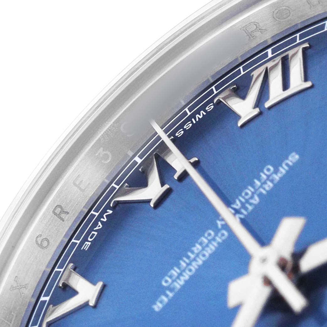 The image shows a close-up of the dial, bezel, and Roman numerals of a Rolex Datejust 41 116300 Men's Stainless Steel Blue Dial watch.