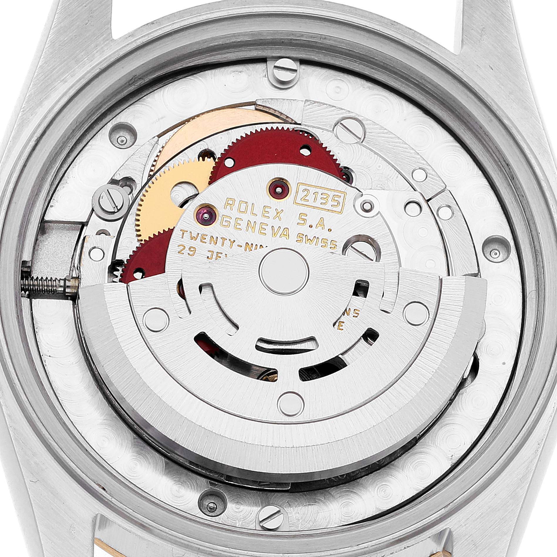 This image shows the intricate internal mechanism of a Mid-Size Rolex watch from a rear angle, displaying its movement parts.