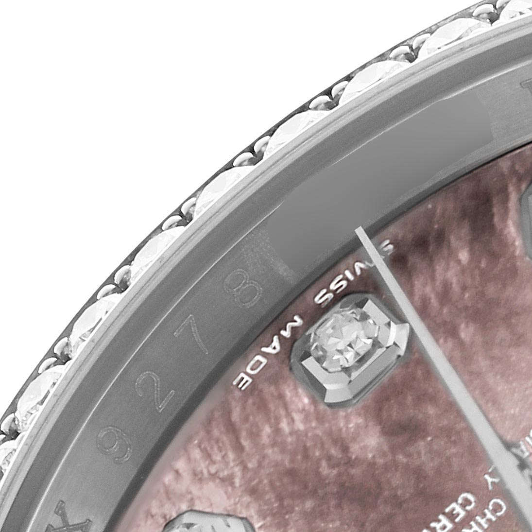 The image shows a close-up of the bezel and part of the dial of a Rolex Datejust 116244 Men's Stainless Steel Mother of Pearl Dial 116244 Men's Stainless Steel Mother of Pearl Dial, highlighting the diamond hour marker and "SWISS MADE" text.