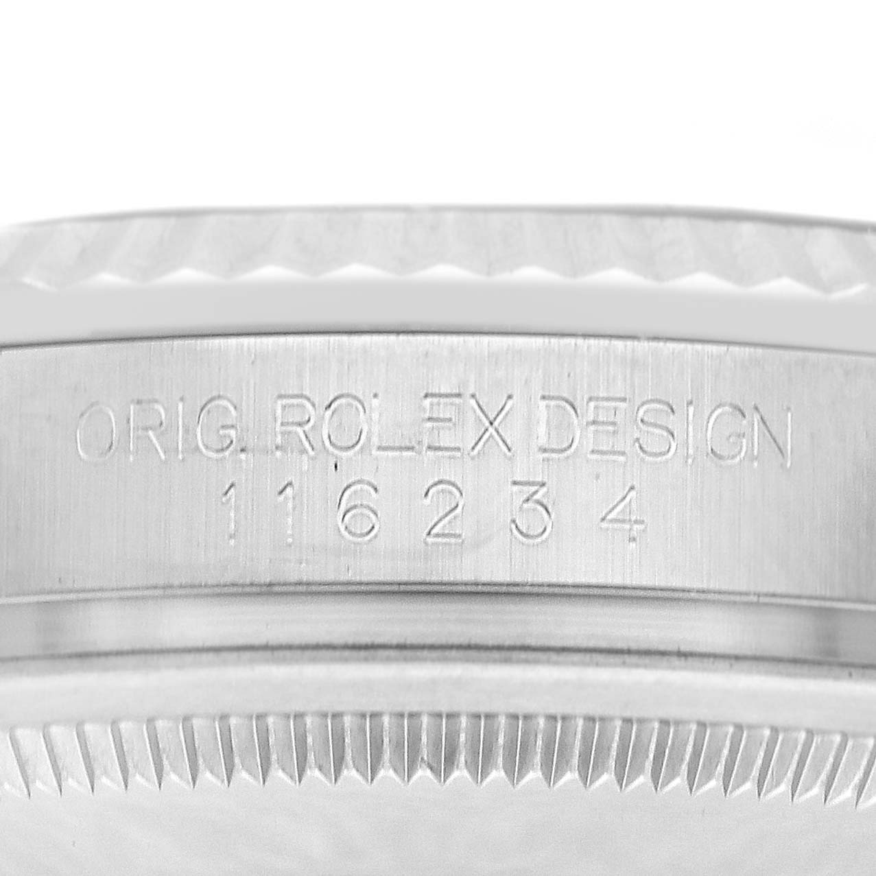 The image shows the side of a Rolex Datejust 116234 Men's Stainless Steel Black Dial 116234 Men's Stainless Steel Black Dial watch, highlighting the engravings on the case.