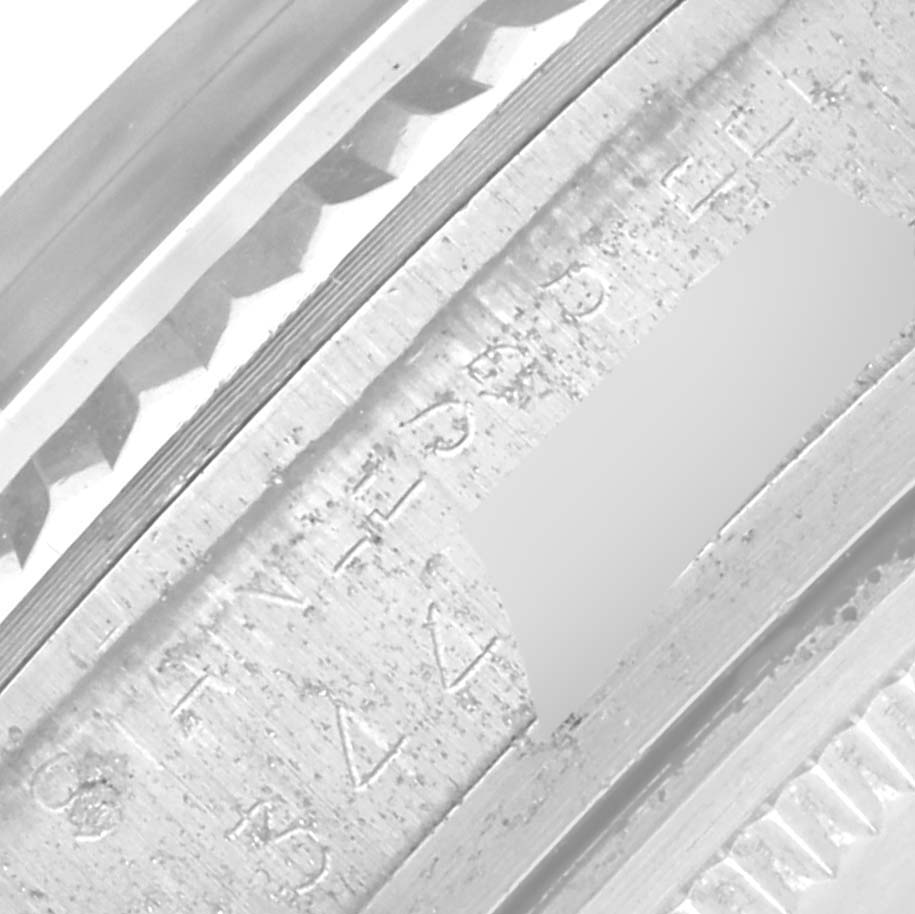 The image shows a close-up view of the engraved inner bezel of a Rolex Datejust 1601 Men's Stainless Steel Grey Dial 1601 Men's Stainless Steel Grey Dial watch.