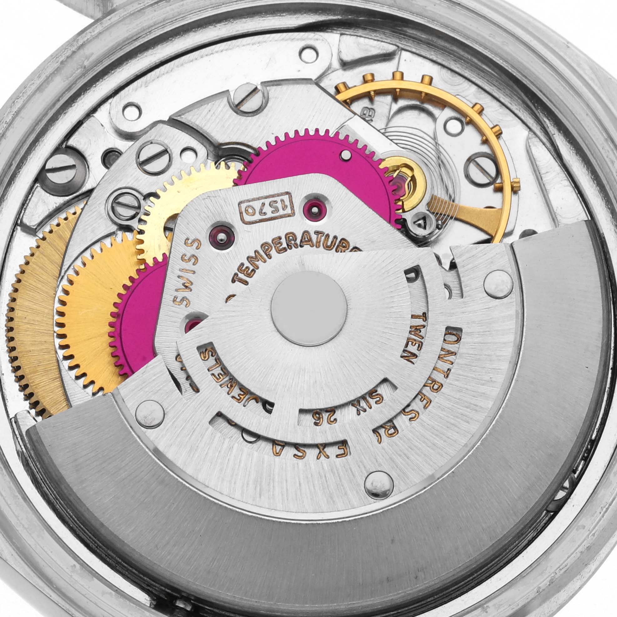 The image shows a close-up of the Rolex Datejust 1601 Men's Stainless Steel Grey Dial 1601 Men's Stainless Steel Grey Dial's internal movement, highlighting gears and the rotor.