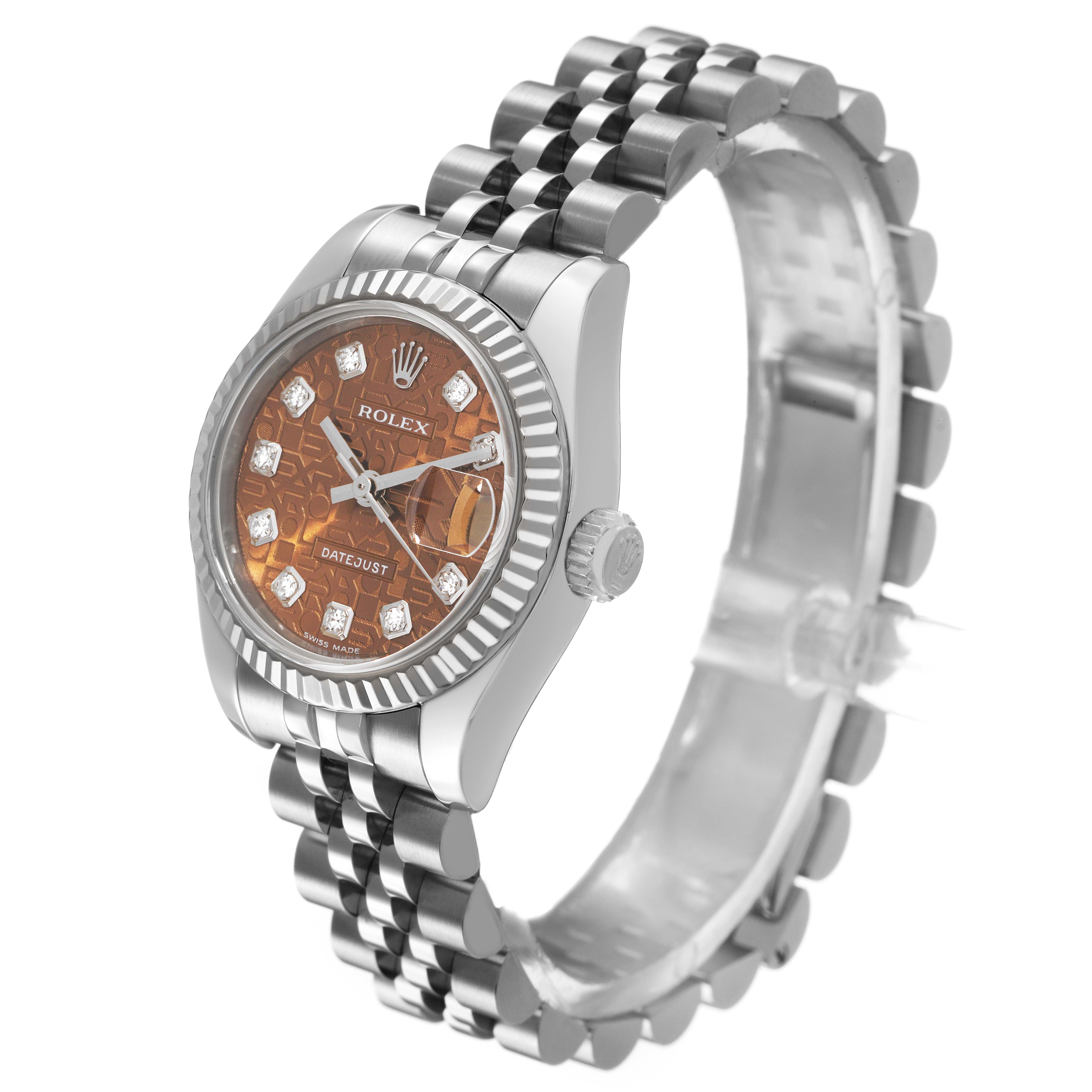The Rolex Datejust 179174 Women's Stainless Steel Pink Dial watch is shown at a slight side angle, highlighting its face, bezel, and bracelet.