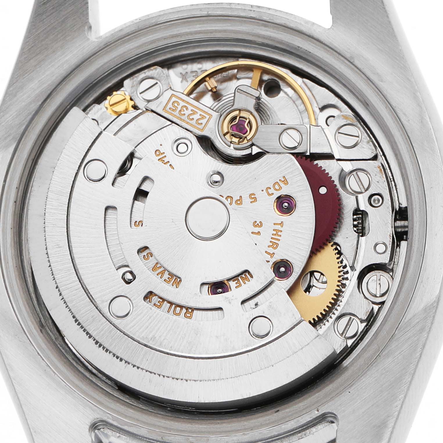 The image shows an overhead view of the Rolex Datejust 179174 Women's Stainless Steel Pink Dial's open case back, revealing its intricate mechanical movement.