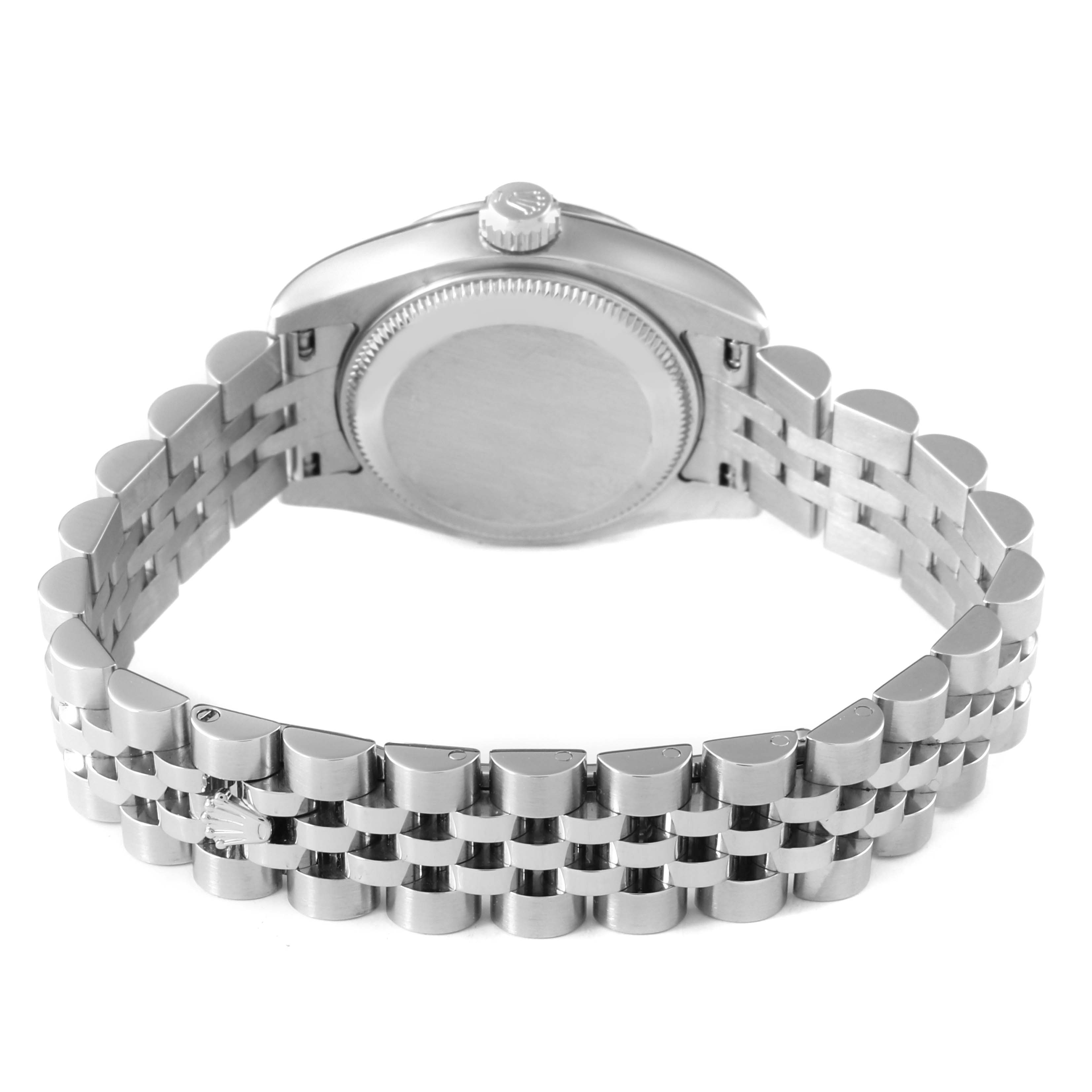 The Rolex Datejust 179174 Women's Stainless Steel Pink Dial watch is shown from the back angle, highlighting the case back and Jubilee bracelet.