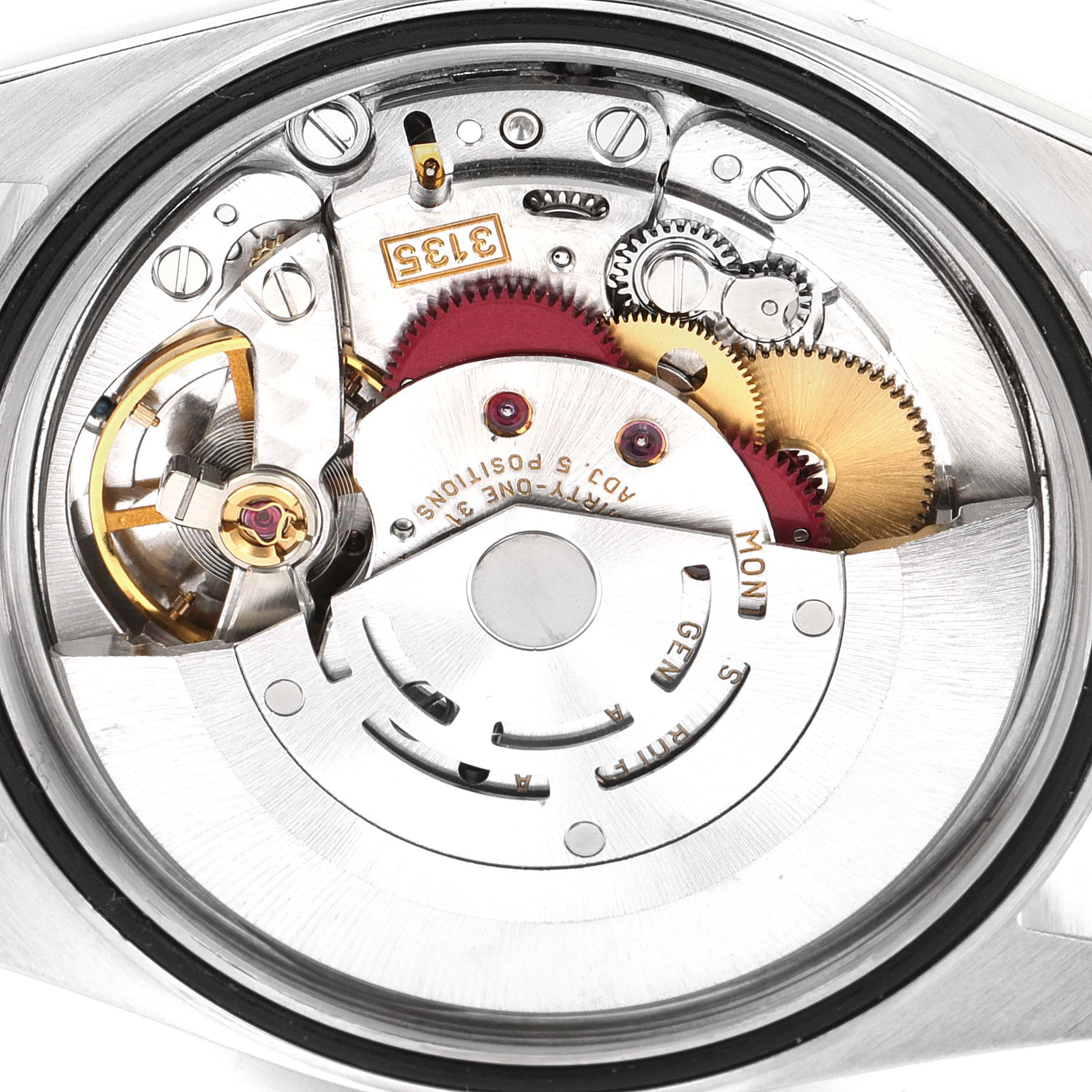 The image shows the internal mechanism of a Rolex Datejust 16234 Men's Stainless Steel Silver Dial 16234 Men's Stainless Steel Silver Dial watch, focusing on the gears and movement components.