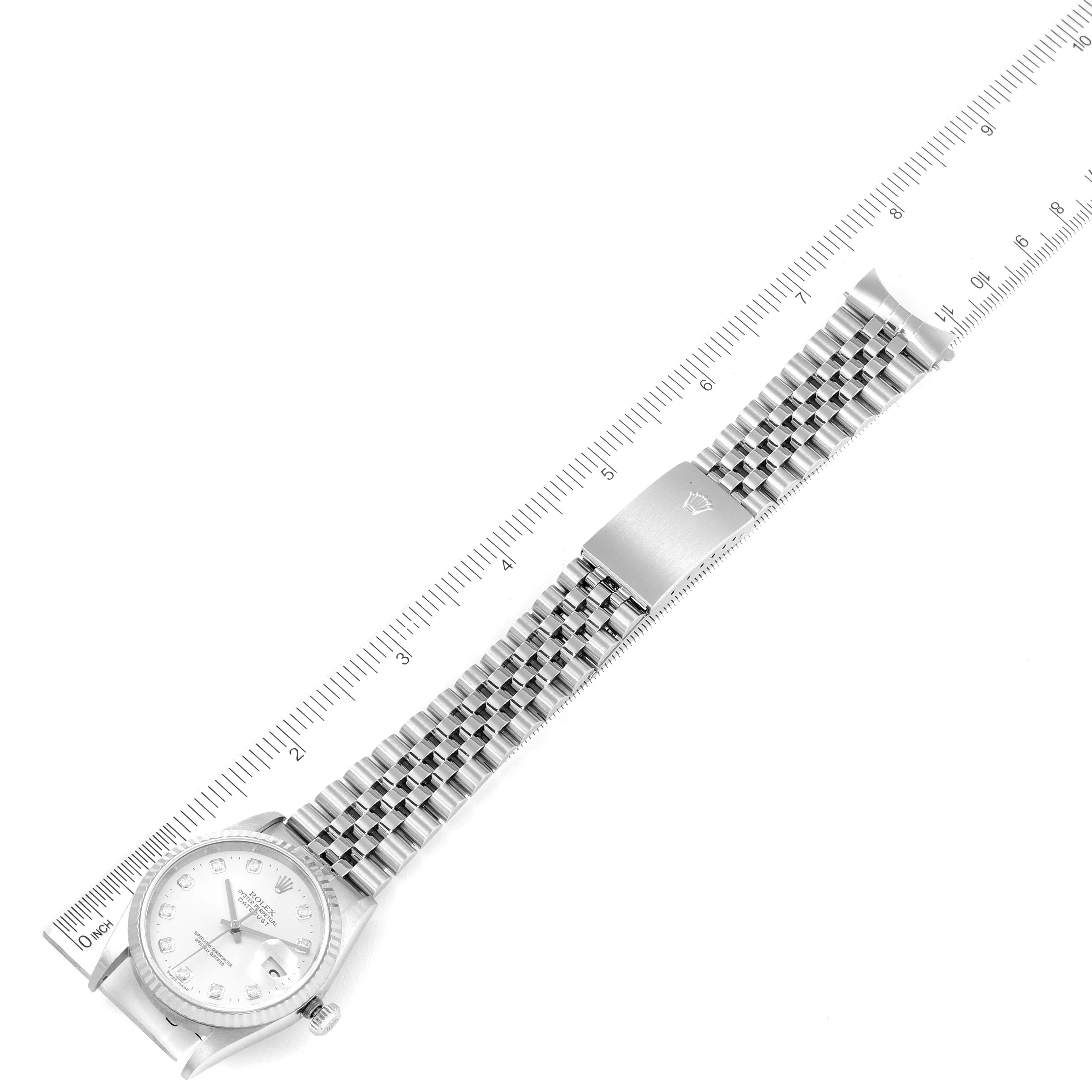 The Rolex Datejust 16234 Men's Stainless Steel Silver Dial 16234 Men's Stainless Steel Silver Dial watch is shown laid flat with its face, bracelet, and clasp visible, measured against a ruler.
