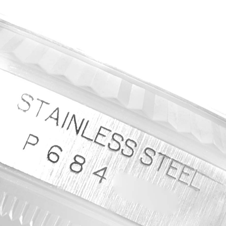 The image shows the side of a Rolex Datejust 16234 Men's Stainless Steel Silver Dial 16234 Men's Stainless Steel Silver Dial watch with the stainless steel engraving and partial serial number.