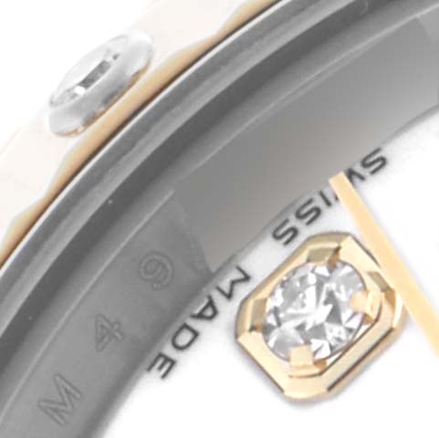 The image shows a close-up of the dial edge and jeweled marker of a Rolex Datejust 179313 Women's Steel and Gold (two tone) White Dial 179313 Women's Steel and Gold (two tone) White Dial, focusing on the "SWISS MADE" text and details.