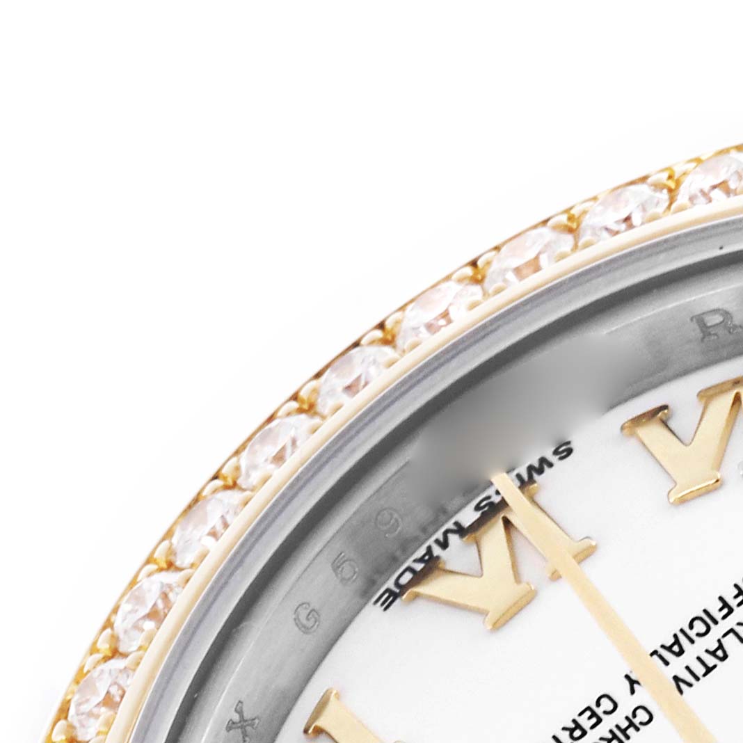 This image shows a close-up of a Rolex Datejust 179383 Women's Steel and Gold (two tone) White Dial 179383 Women's Steel and Gold (two tone) White Dial watch's dial and diamond-encrusted bezel at an angled view.