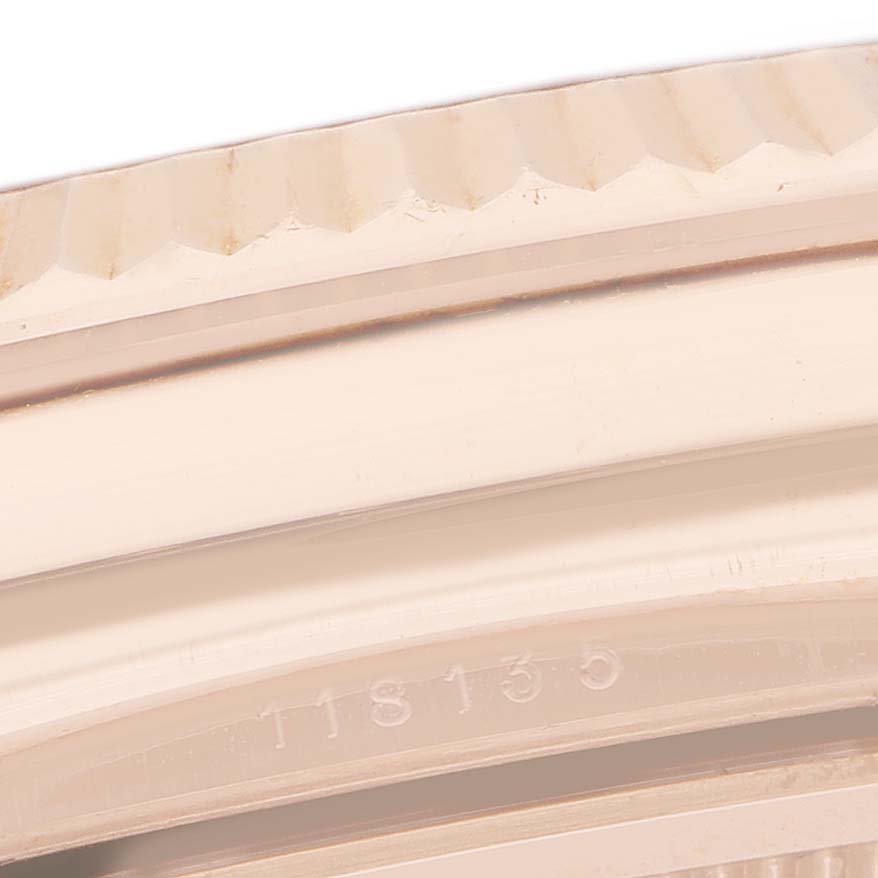 The image shows a close-up of the fluted bezel and part of the case edge of a Rolex President 118135 Men's Rose Gold Silver Dial watch.