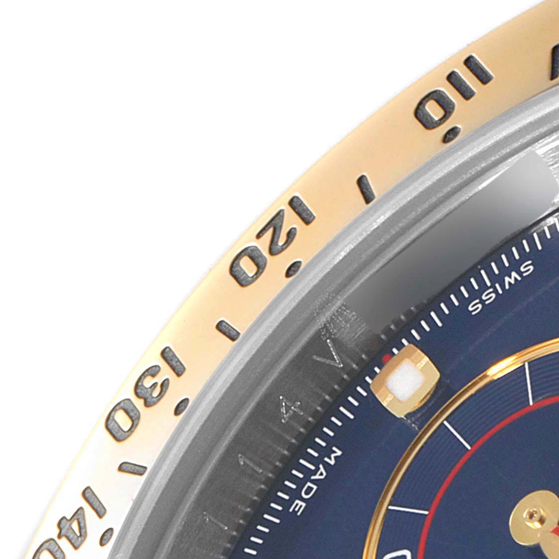 The image shows a close-up of the bezel and partial dial of a Rolex Daytona 116523 Men's Steel and Gold (two tone) Blue Dial 116523 Men's Steel and Gold (two tone) Blue Dial watch, highlighting the tachymeter scale.