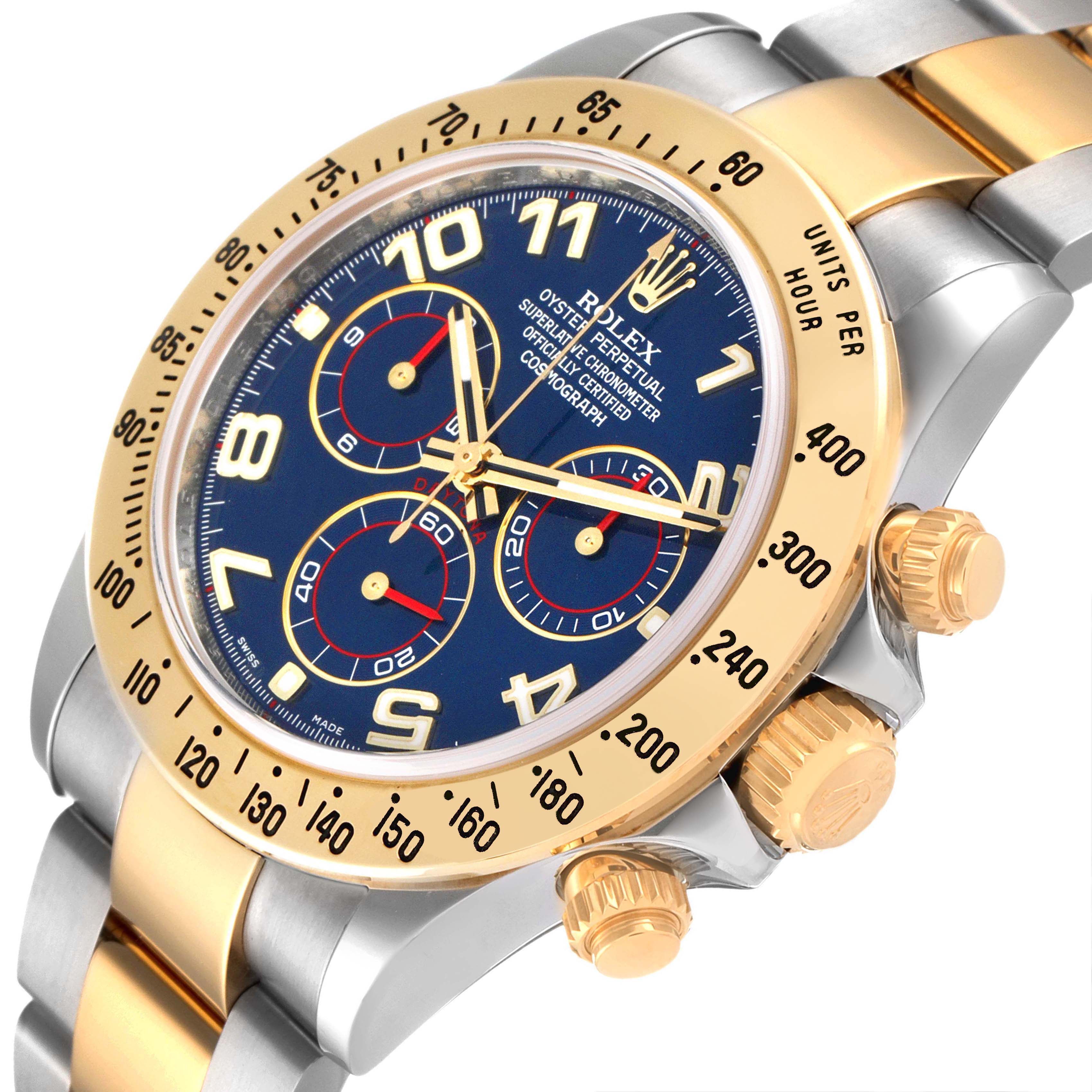 The image shows a close-up, angled view of the dial, bezel, and crown of a Rolex Daytona 116523 Men's Steel and Gold (two tone) Blue Dial 116523 Men's Steel and Gold (two tone) Blue Dial watch.