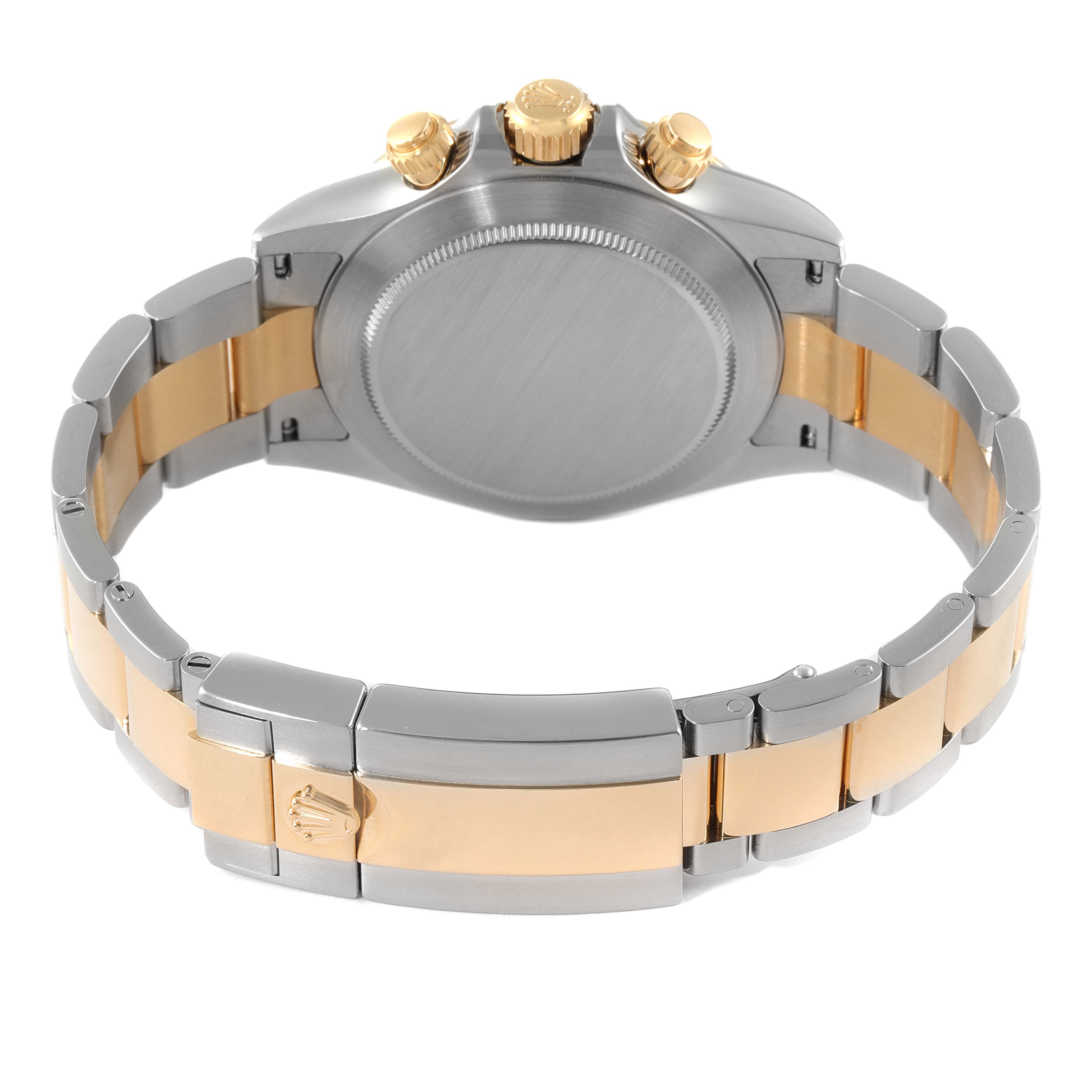 This image shows the back case and bracelet of a Rolex Daytona 116523 Men's Steel and Gold (two tone) Blue Dial 116523 Men's Steel and Gold (two tone) Blue Dial watch, highlighting the clasp and crown.