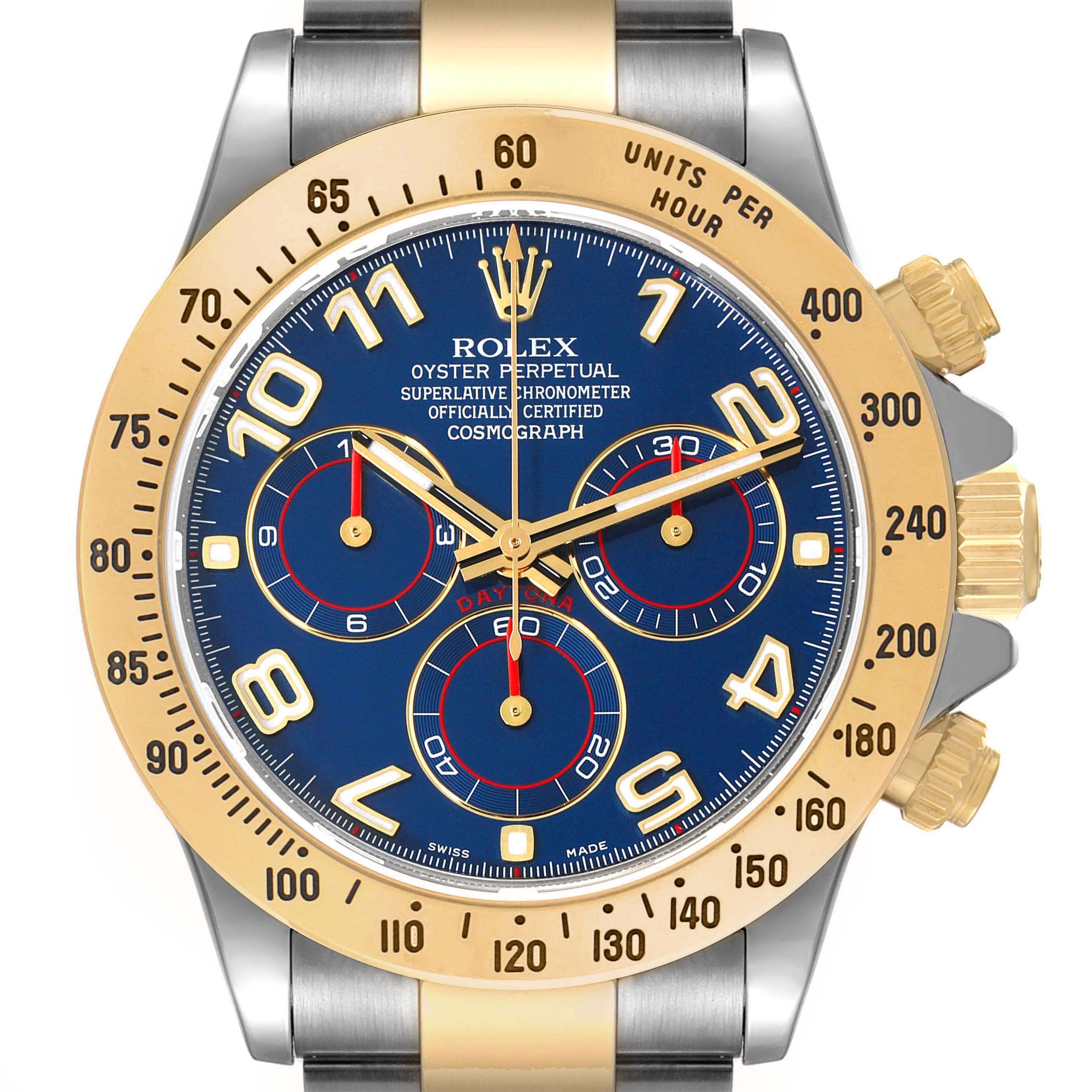 The Rolex Daytona 116523 Men's Steel and Gold (two tone) Blue Dial 116523 Men's Steel and Gold (two tone) Blue Dial watch is shown from a top-down angle, displaying its dial, bezel, and crown.