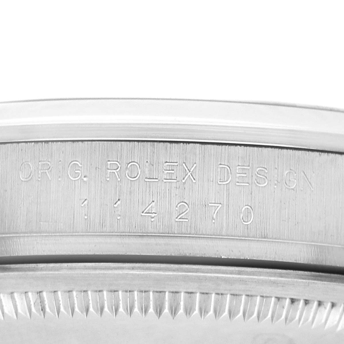 The image shows a close-up of the engraved side of a Rolex Explorer 114270 Men's Stainless Steel Black Dial, displaying the model number.
