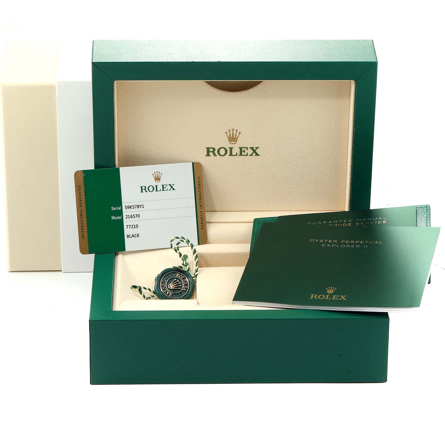 The image shows a Rolex Explorer 216570 Men
s Stainless Steel Black Dial 216570 Men
s Stainless Steel Black Dial watch box, warranty card, manuals, and a hangtag, all from a top-down angle.