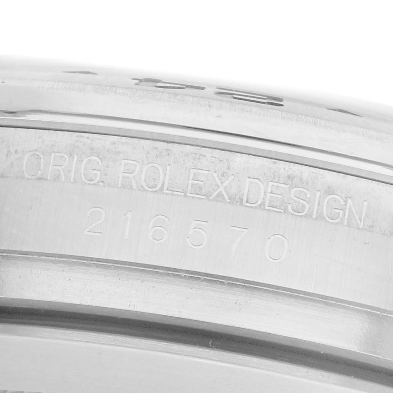 The image shows a close-up of the side engraving on a Rolex Explorer 216570 Men's Stainless Steel White Dial 216570 Men's Stainless Steel White Dial watch, displaying "ORIG. ROLEX DESIGN" and the model number.