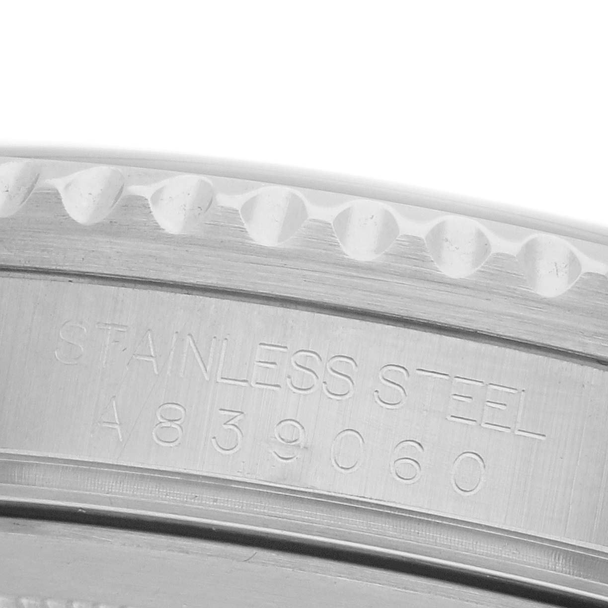 The image shows a close-up of the side of a Rolex GMT-Master 16710 Men's Stainless Steel Black Dial 16710 Men's Stainless Steel Black Dial, highlighting the stainless steel engravings.