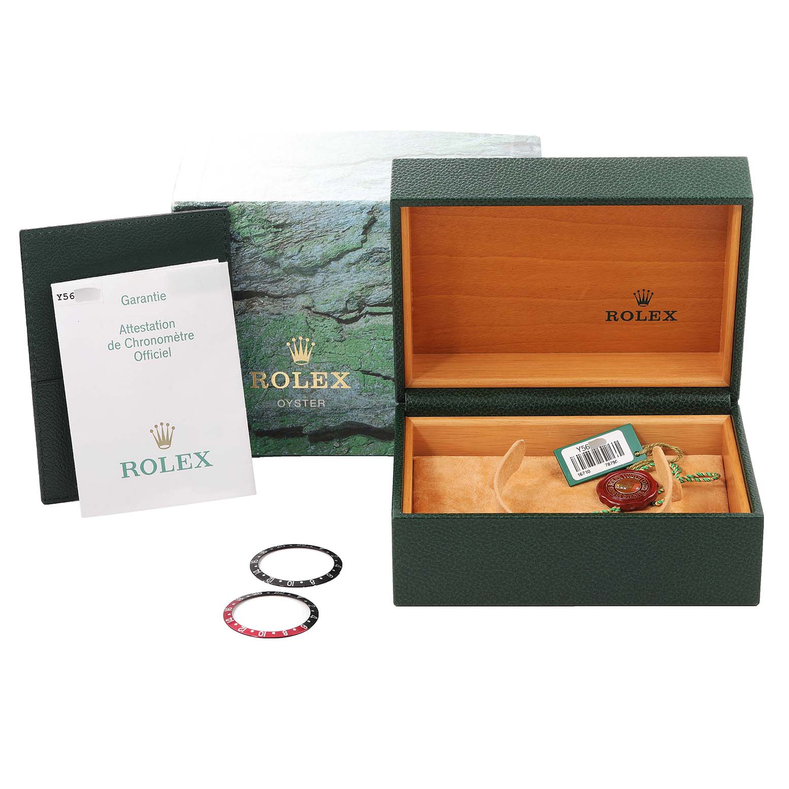 The image shows the packaging contents of a Rolex GMT-Master 16710 Men
s Stainless Steel Black Dial 16710 Men
s Stainless Steel Black Dial, including a box, guarantee, tags, and two bezel inserts.