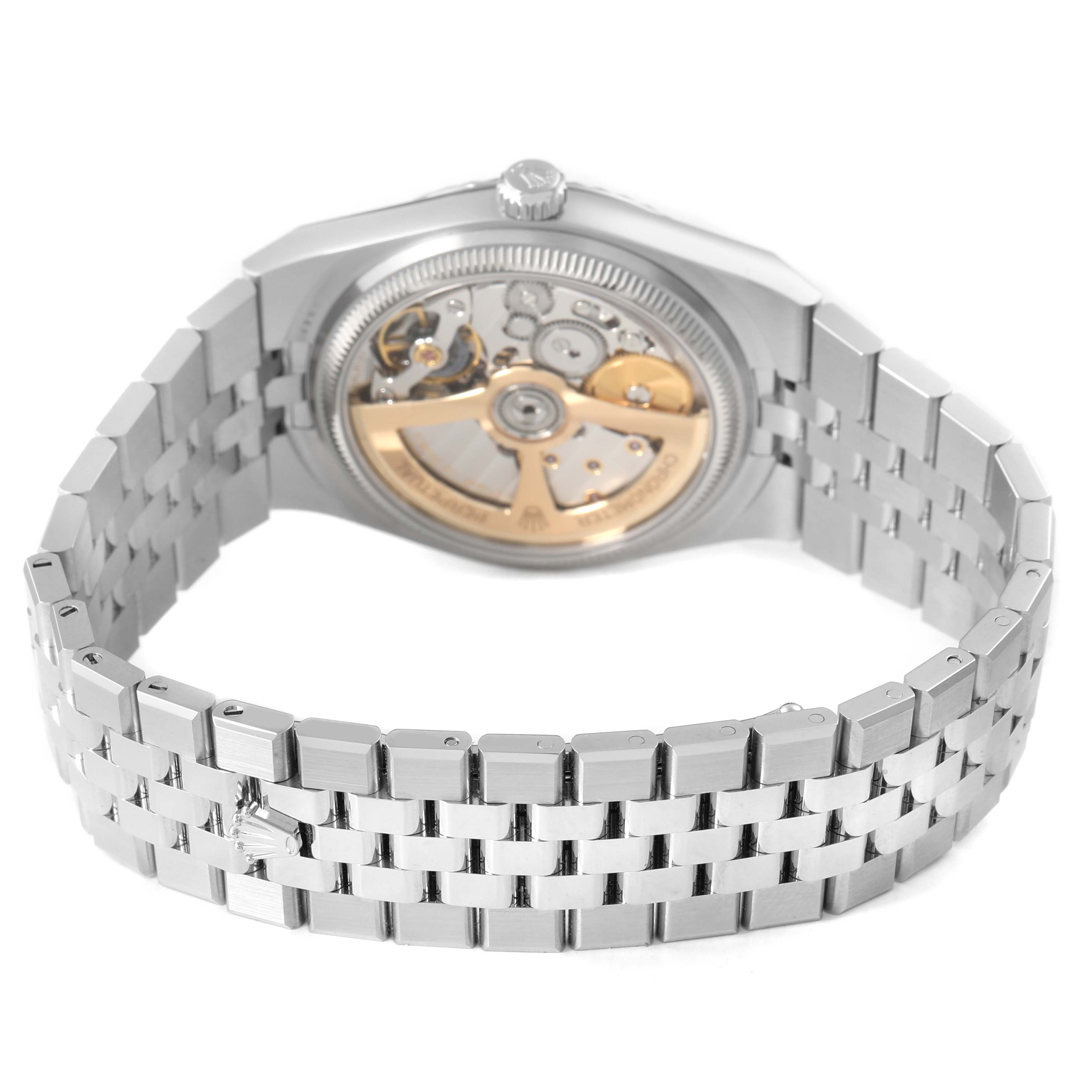 The image shows the back view of the Rolex Land‑Dweller 127234 Men's Steel and Gold (two tone) Silver Dial, highlighting the open case back and bracelet.