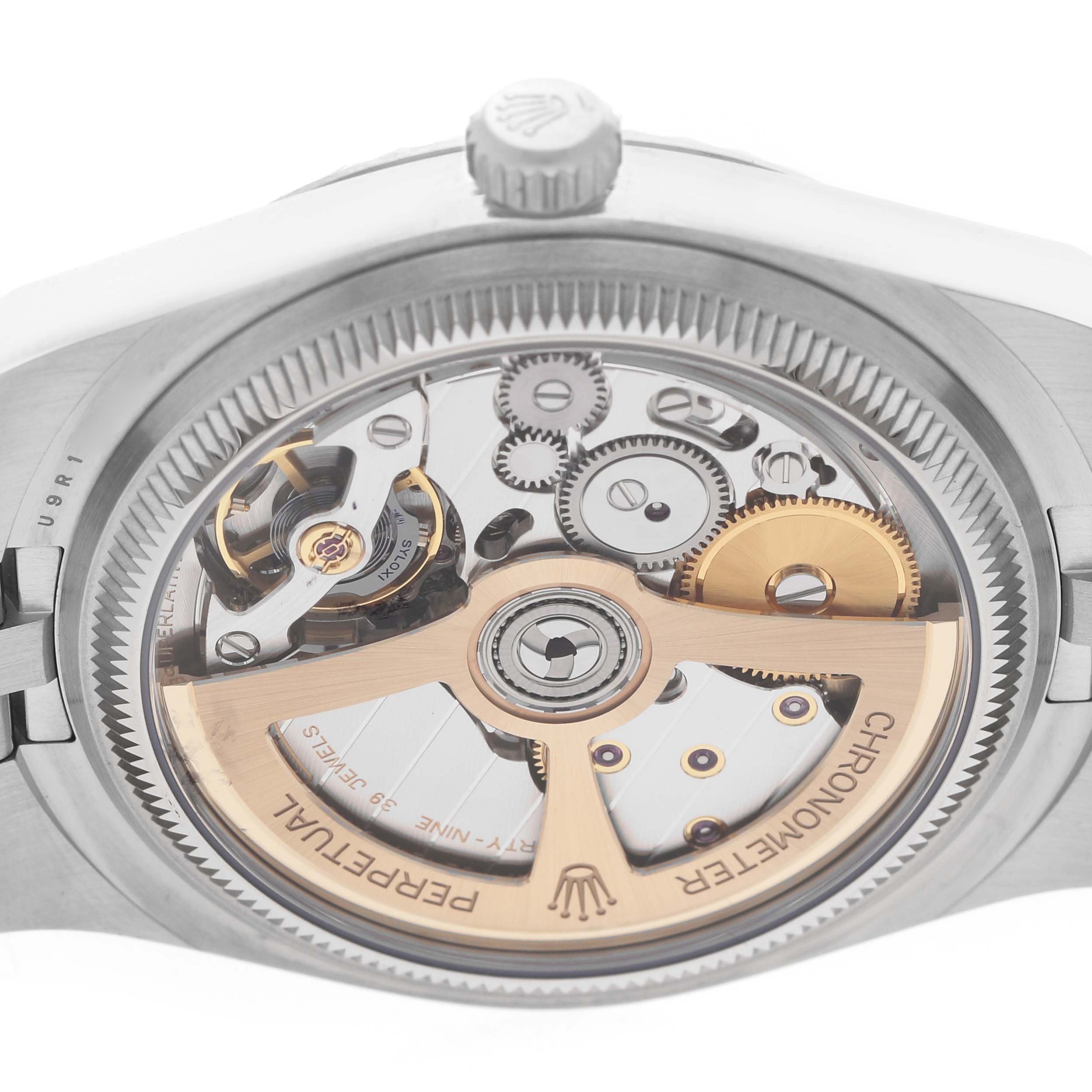 The image shows the back view of the Rolex Land-Dweller, highlighting its intricate movement and components.