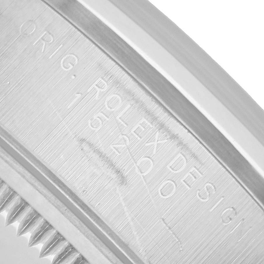 The image shows the engraved side of the case of a Rolex Date 15200 Men's Stainless Steel Black Dial model, highlighting its serial and model numbers.