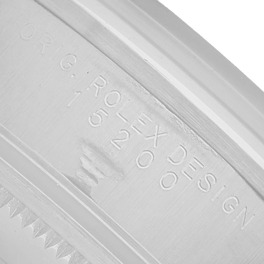 The image shows an angled close-up of the engraved case side of a Rolex Date 15200 Men's Stainless Steel Black Dial model, highlighting "ROLEX DESIGN 15200".