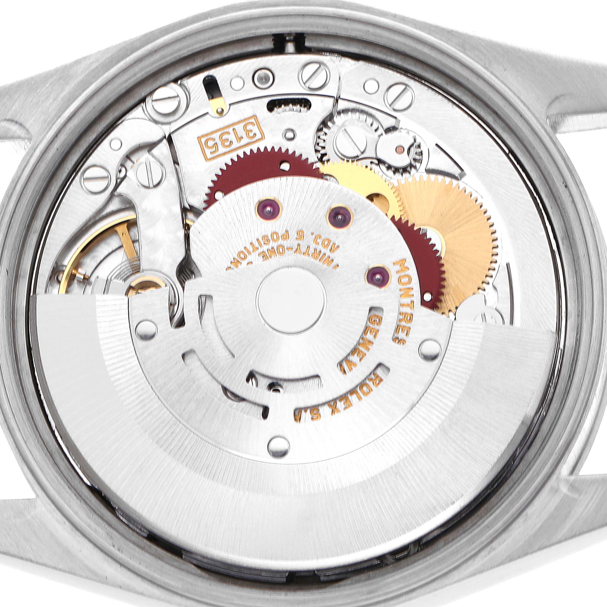 The image shows the internal mechanism of a Rolex Date 15200 Men's Stainless Steel Silver Dial watch, capturing the rotor and gears from the back.