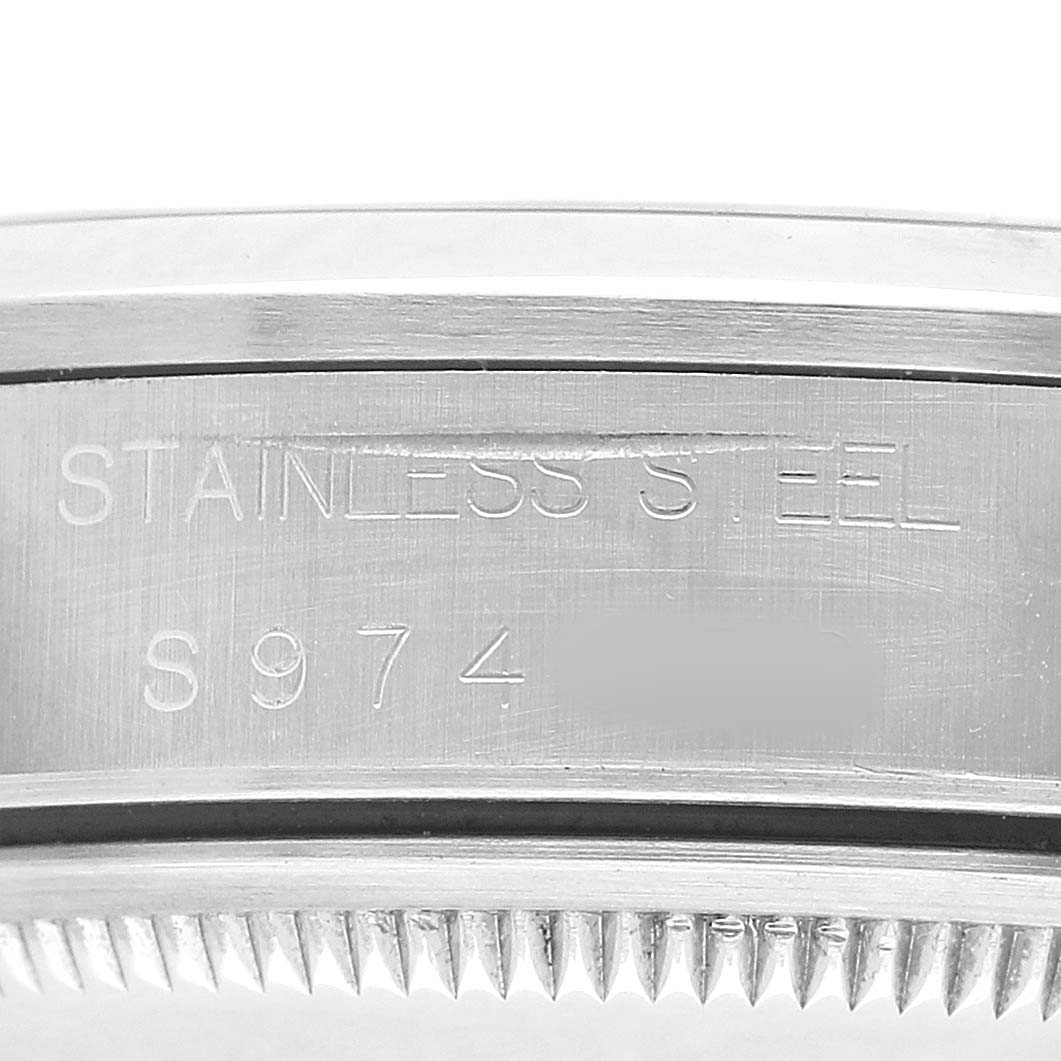 The image shows the side view of the case edge, serial number, and material marking on the Rolex Date 15200 Men's Stainless Steel Silver Dial watch.