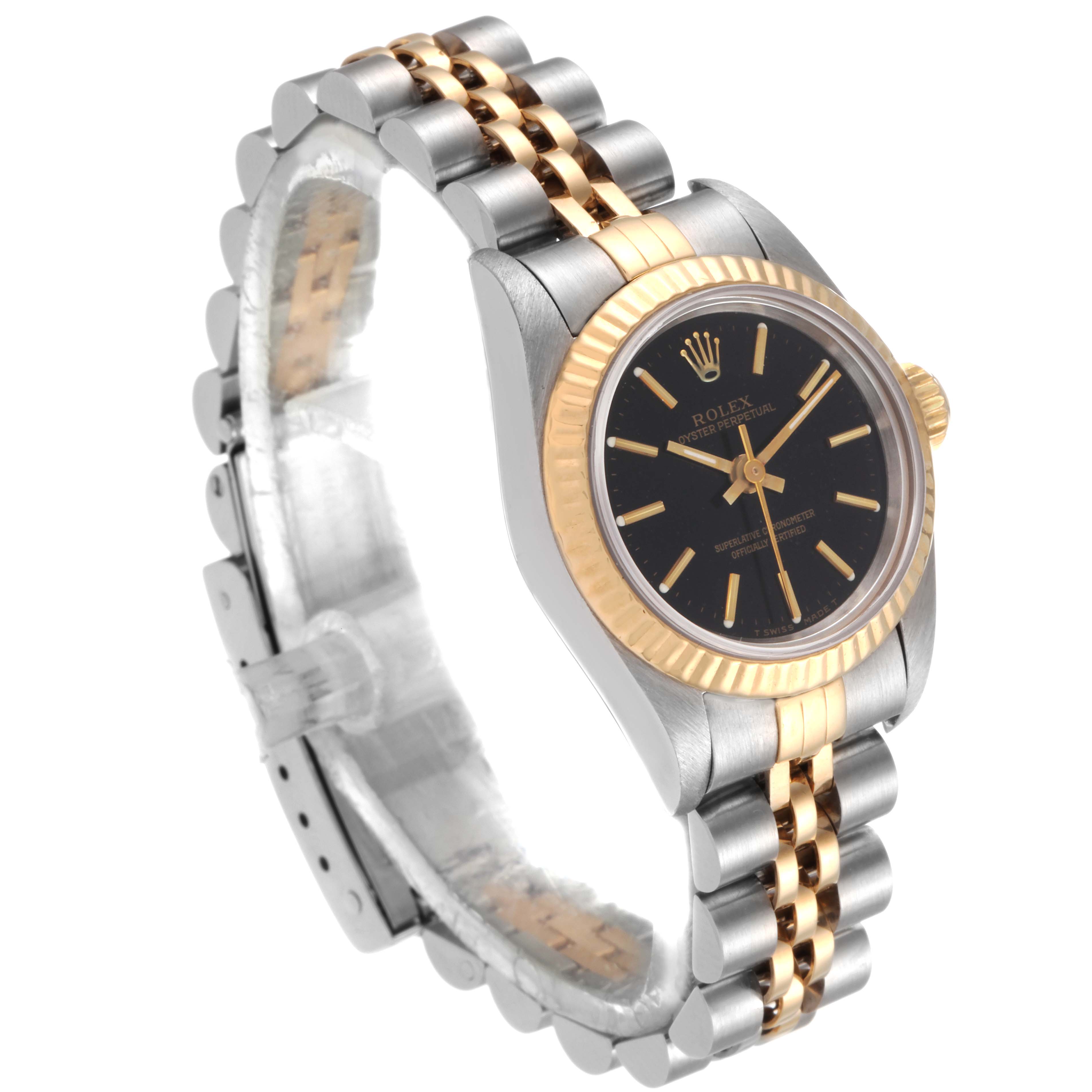The Rolex Oyster Perpetual 67193 Women
s Steel and Gold (two tone) Black Dial 67193 Women
s Steel and Gold (two tone) Black Dial watch is shown at an angled side view, highlighting its two-tone bracelet and fluted bezel.