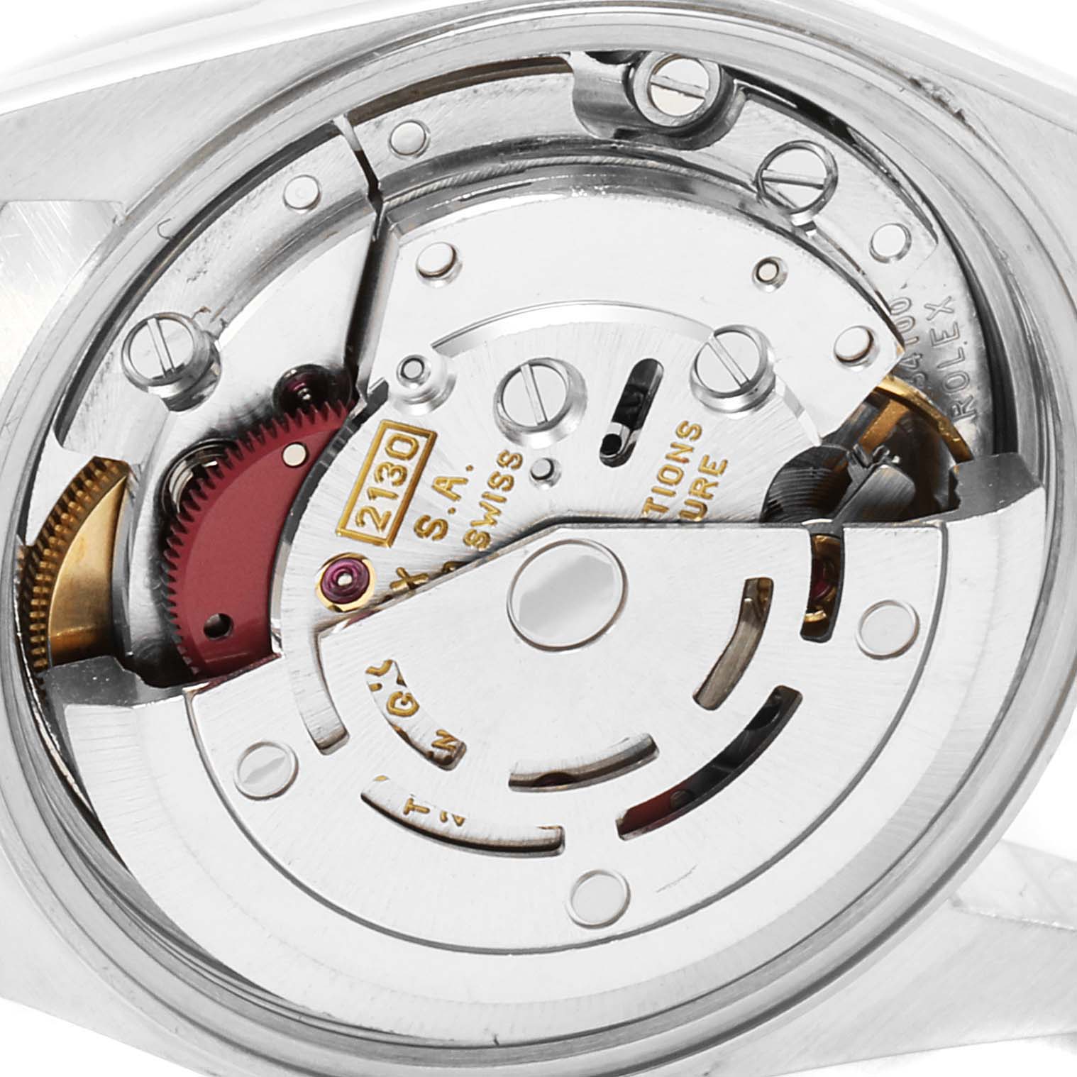 The image shows a close-up of the movement mechanism of a Rolex Oyster Perpetual 67193 Women
s Steel and Gold (two tone) Black Dial 67193 Women
s Steel and Gold (two tone) Black Dial watch, highlighting the intricate internal parts.