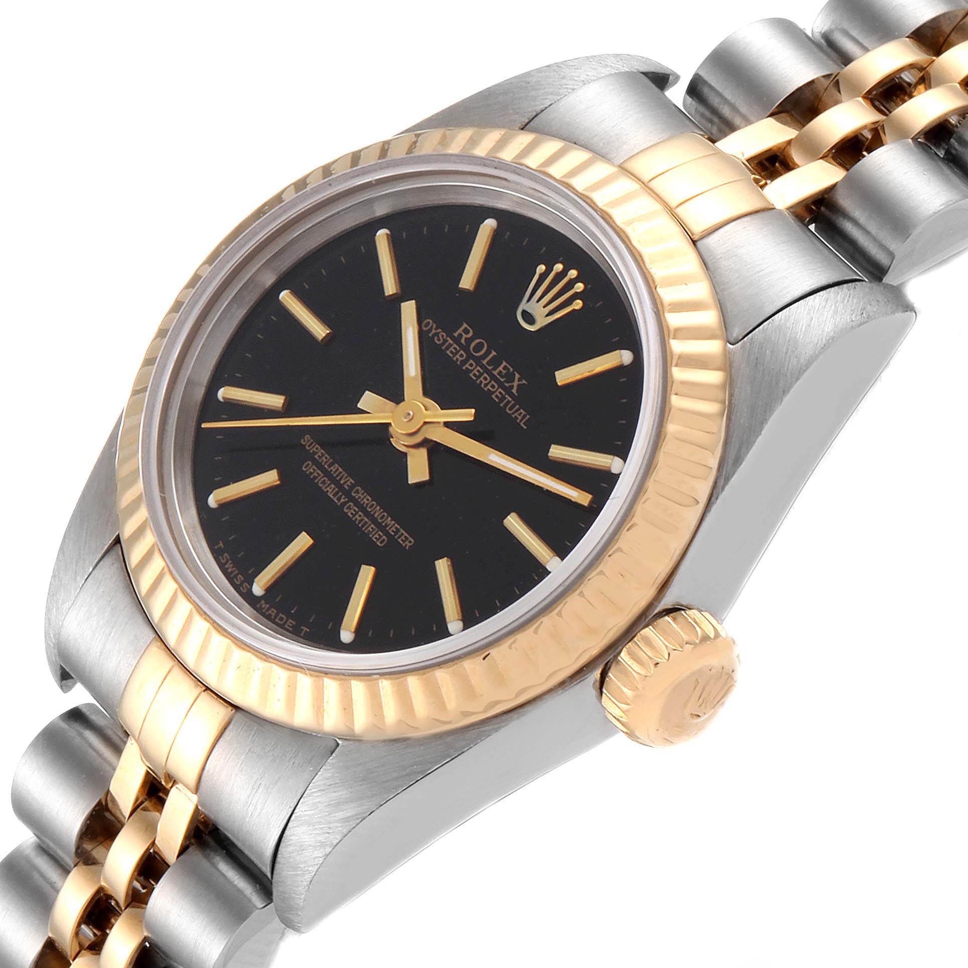 This image shows a close-up angle of the Rolex Oyster Perpetual 67193 Women
s Steel and Gold (two tone) Black Dial 67193 Women
s Steel and Gold (two tone) Black Dial watch, featuring its black dial, gold bezel, and two-tone bracelet.