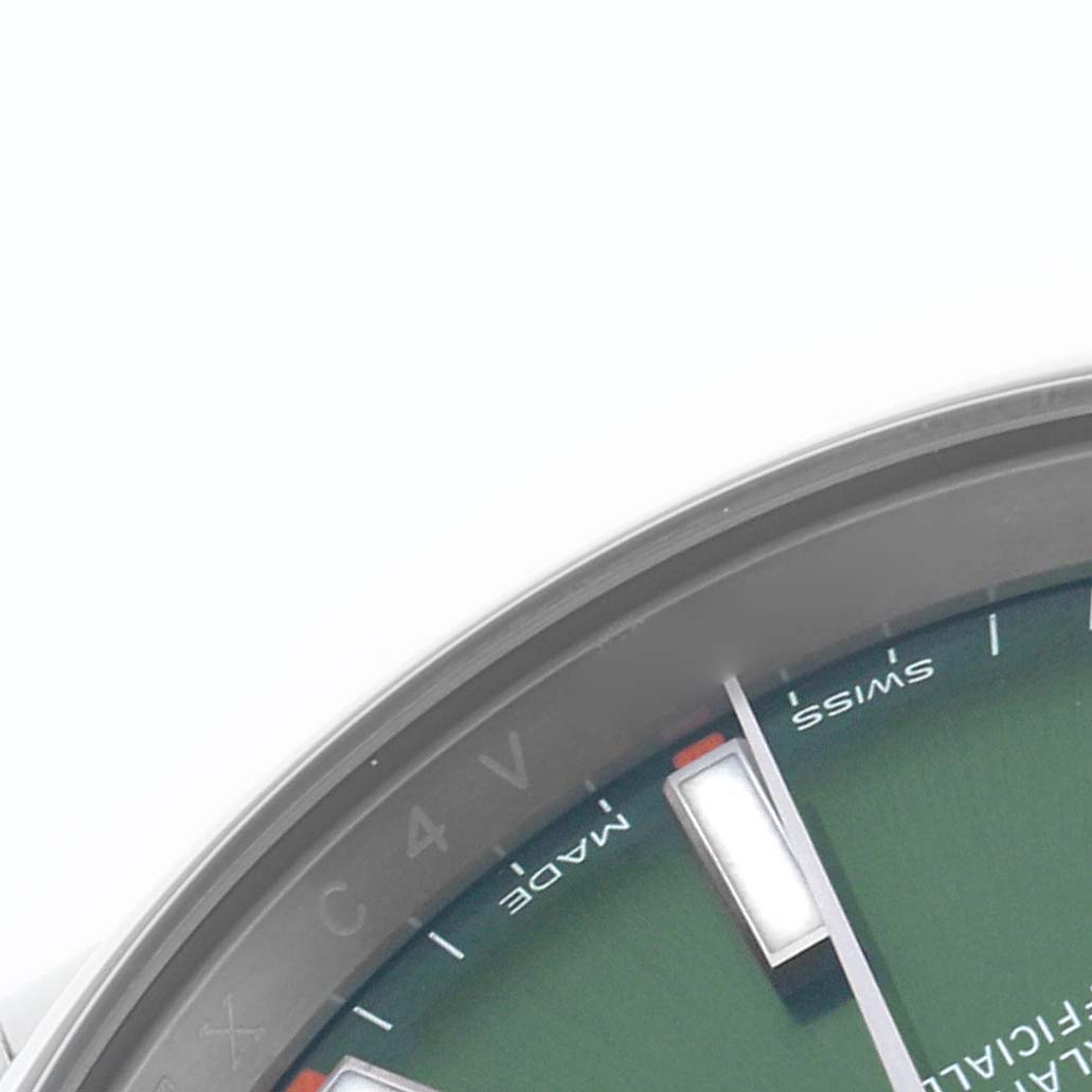 The image shows a close-up of the dial and bezel of the Rolex Oyster Perpetual 114200 Men's Stainless Steel Green Dial 114200 Men's Stainless Steel Green Dial watch, focusing on the edge details and markers.