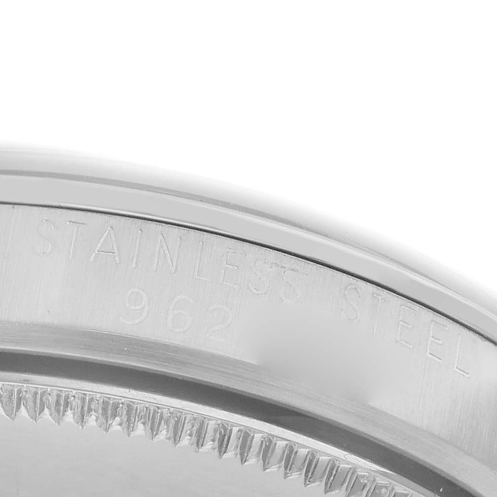 The image shows a close-up of the case back edge of a Rolex Vintage Collection 6430 Men's Stainless Steel Black Dial 6430 Men's Stainless Steel Black Dial watch, highlighting the stainless steel material inscription.