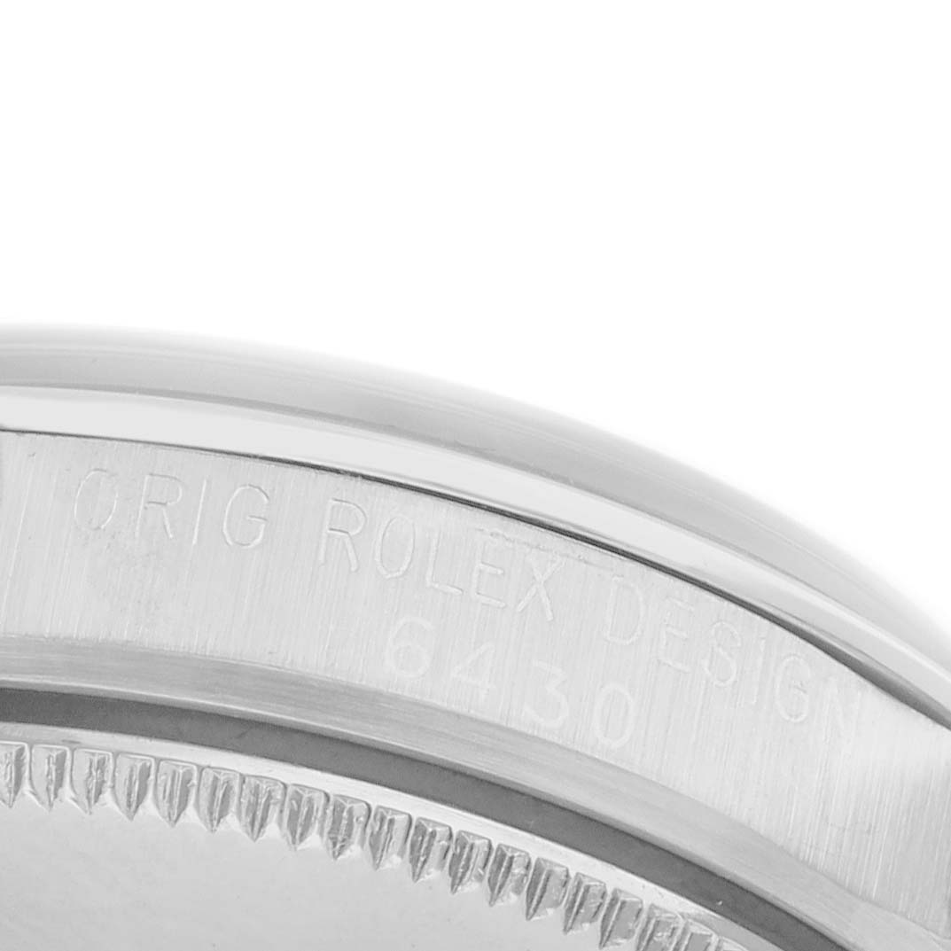 The image shows a close-up of the side of a Vintage Collection model by Rolex, highlighting the engraved bezel and model number.