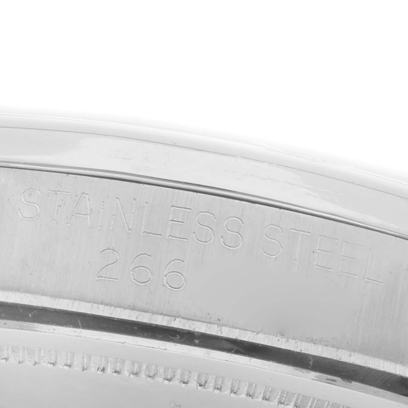 The image shows a close-up of the stainless steel case back of a Rolex Date 6694 Men's Stainless Steel Silver Dial 6694 Men's Stainless Steel Silver Dial watch, highlighting engravings.