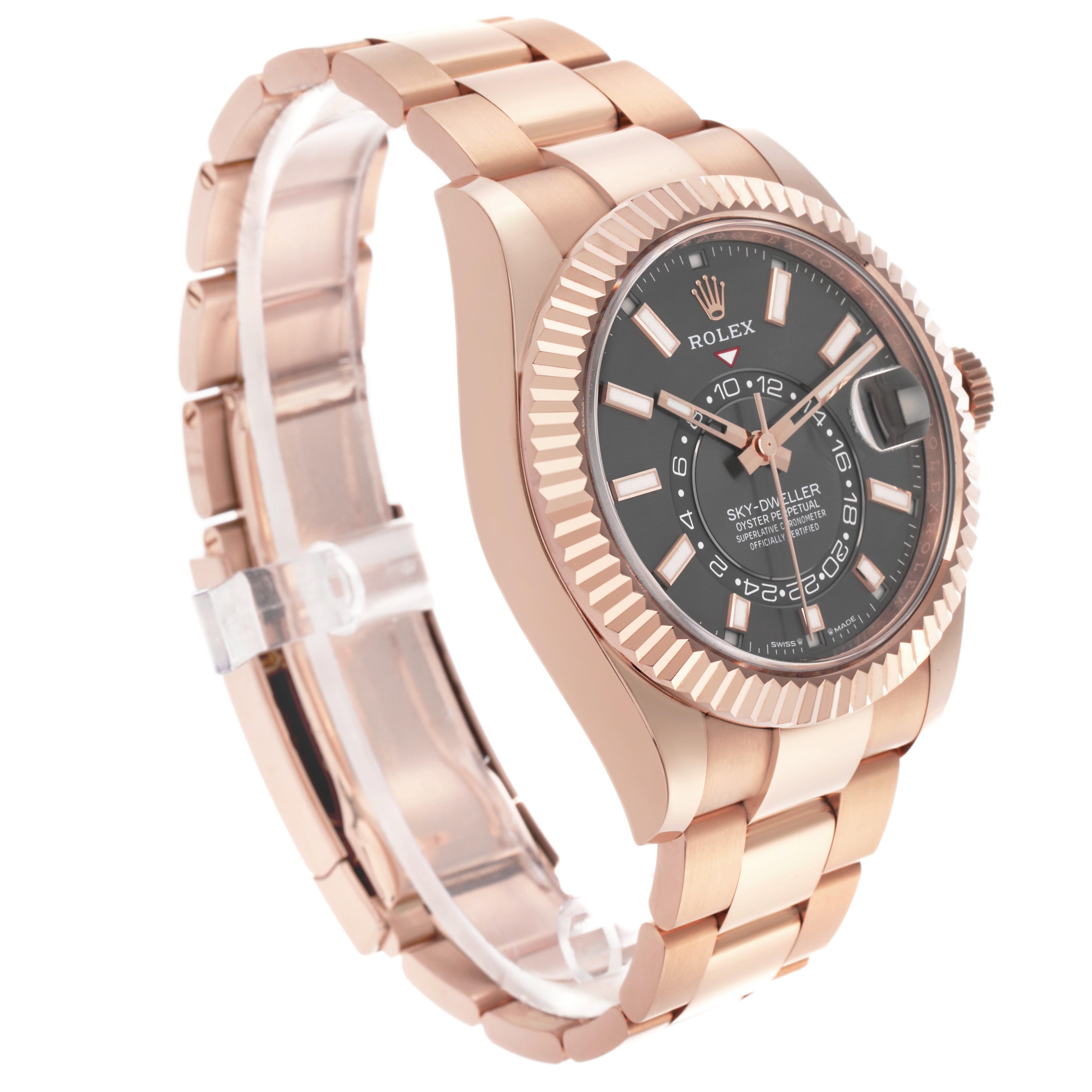 The Rolex Sky-Dweller 336935 Men's Rose Gold Grey Dial watch is shown at a three-quarter angle, highlighting the face, bezel, crown, and bracelet.