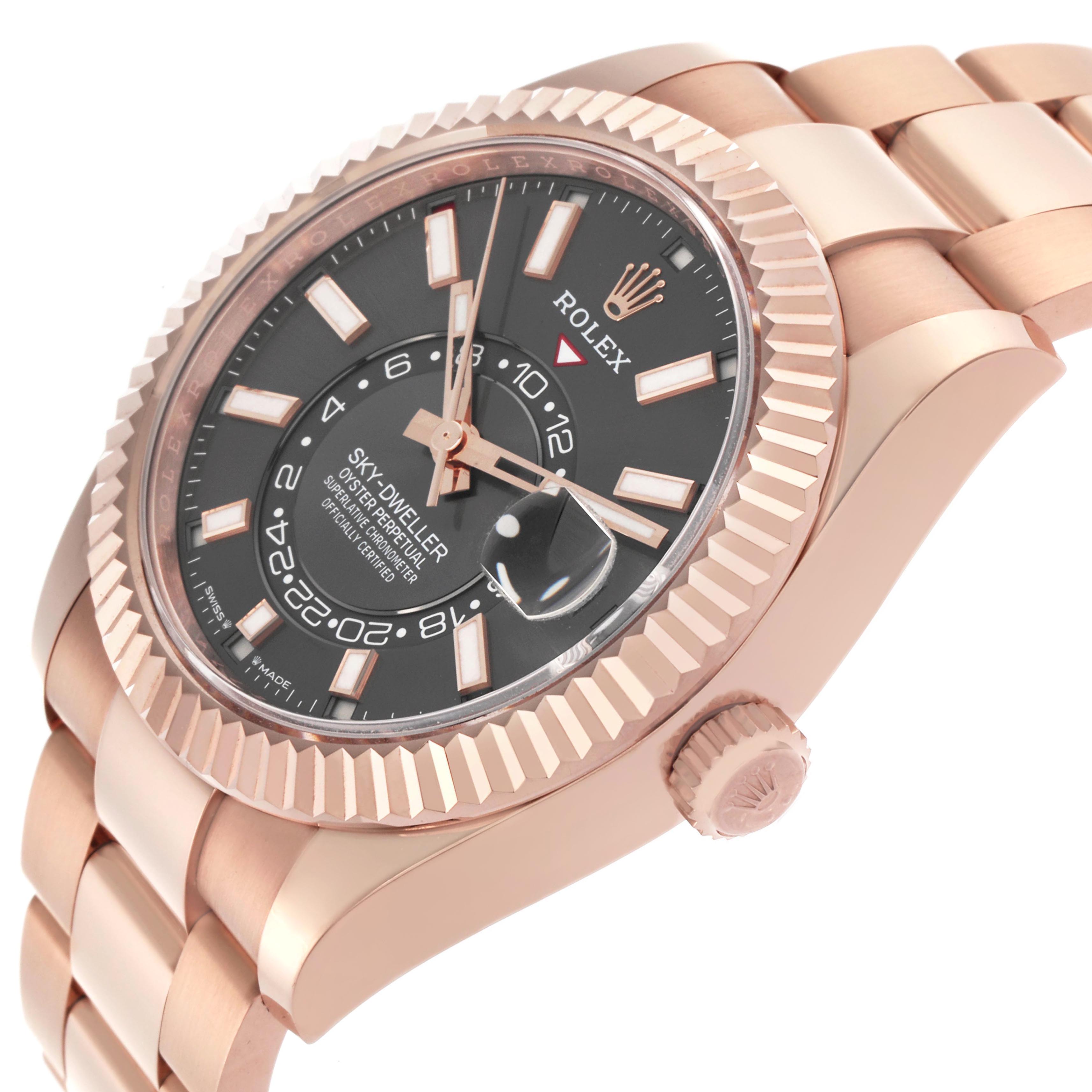 The Rolex Sky-Dweller 336935 Men's Rose Gold Grey Dial watch is shown at an angle highlighting the bezel, dial, crown, and part of the bracelet.