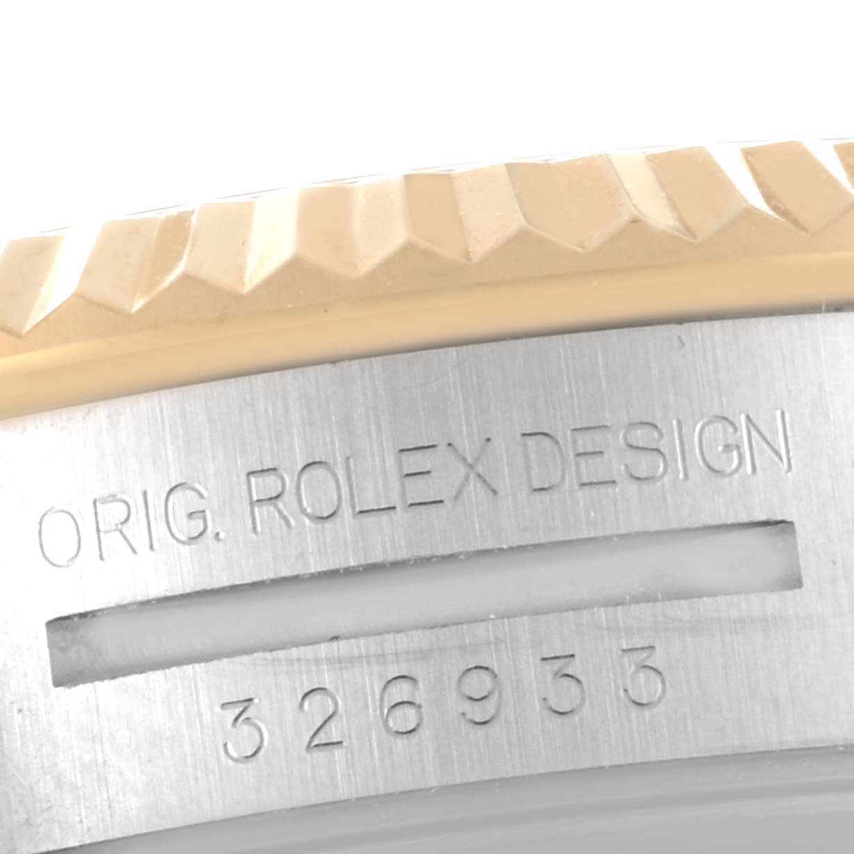 The image shows a close-up angle of the Rolex Sky-Dweller 326933 Men's Steel and Gold (two tone) Black Dial 326933 Men's Steel and Gold (two tone) Black Dial's bezel and part of the watch case with the engravings "ORIG. ROLEX DESIGN" and "326933".