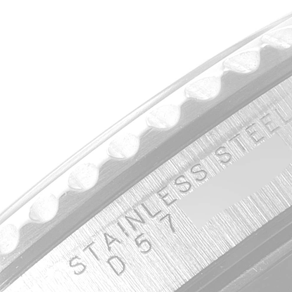 This image shows a close-up of the stainless steel engraved serial number on the edge of the Rolex Submariner 14060 Men
s Stainless Steel Black Dial 14060 Men
s Stainless Steel Black Dial watch case.