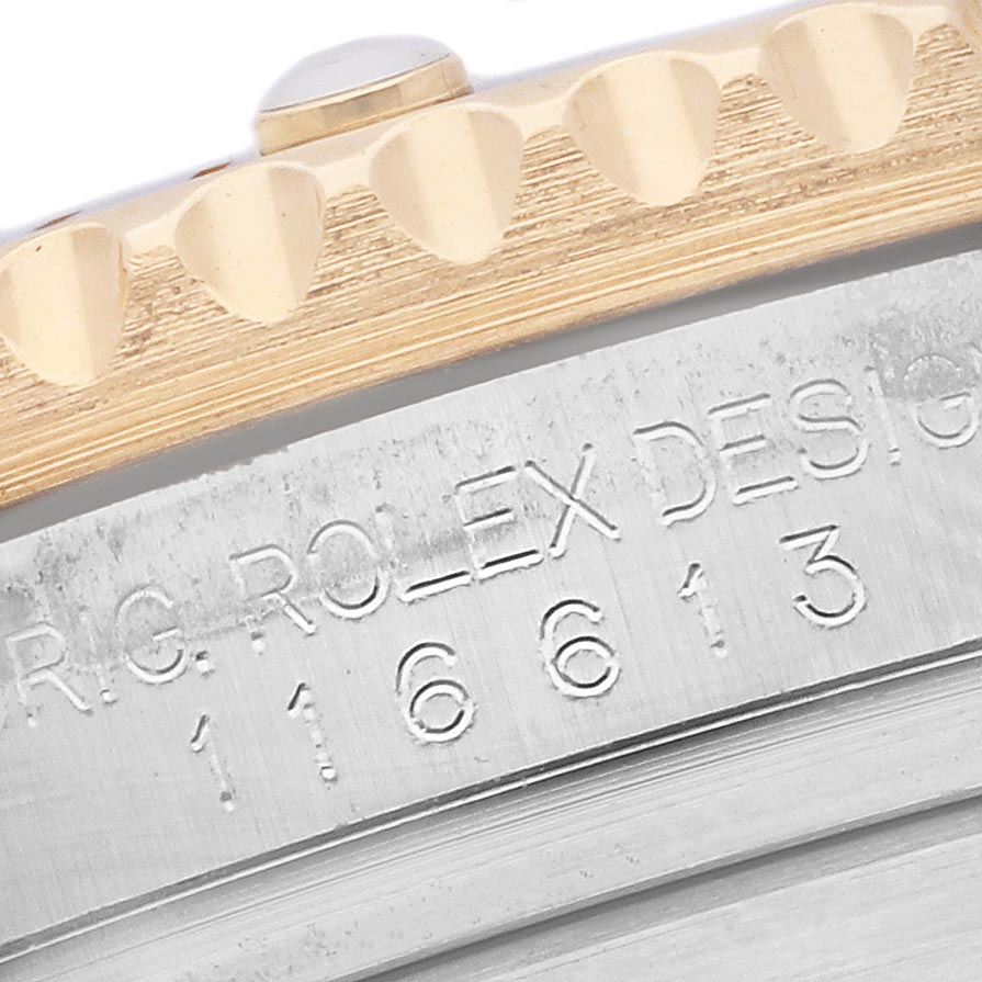 The image shows a close-up of the bezel and engraving on a Rolex Submariner 116613 Men's Steel and Gold (two tone) Black Dial 116613 Men's Steel and Gold (two tone) Black Dial, highlighting the model number.
