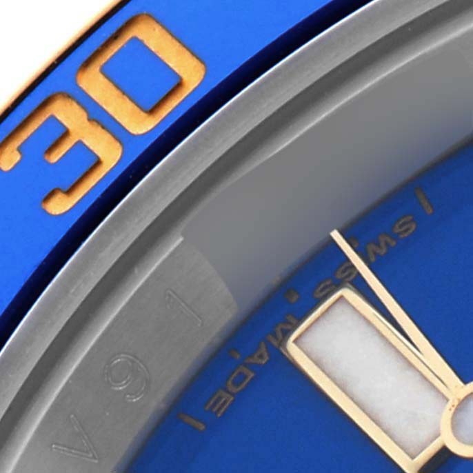 The image shows a close-up of the bezel and dial of a Rolex Submariner 116613LB Men's Steel and Gold (two tone) Blue Dial 116613LB Men's Steel and Gold (two tone) Blue Dial, highlighting the "30" marker and part of the watch face.
