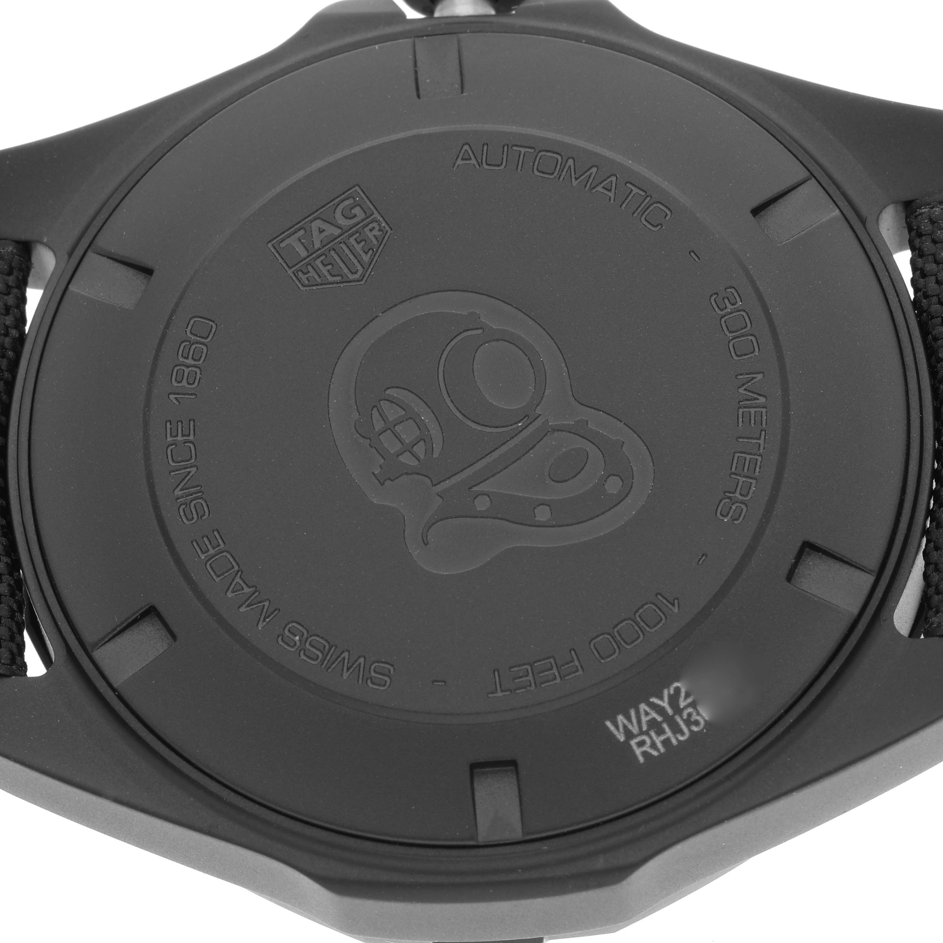 The image shows the case back of a Tag Heuer Aquaracer WAY208A.FC6381 Men's Titanium Black Dial WAY208A.FC6381 Men's Titanium Black Dial watch, highlighting its engravings and water resistance.
