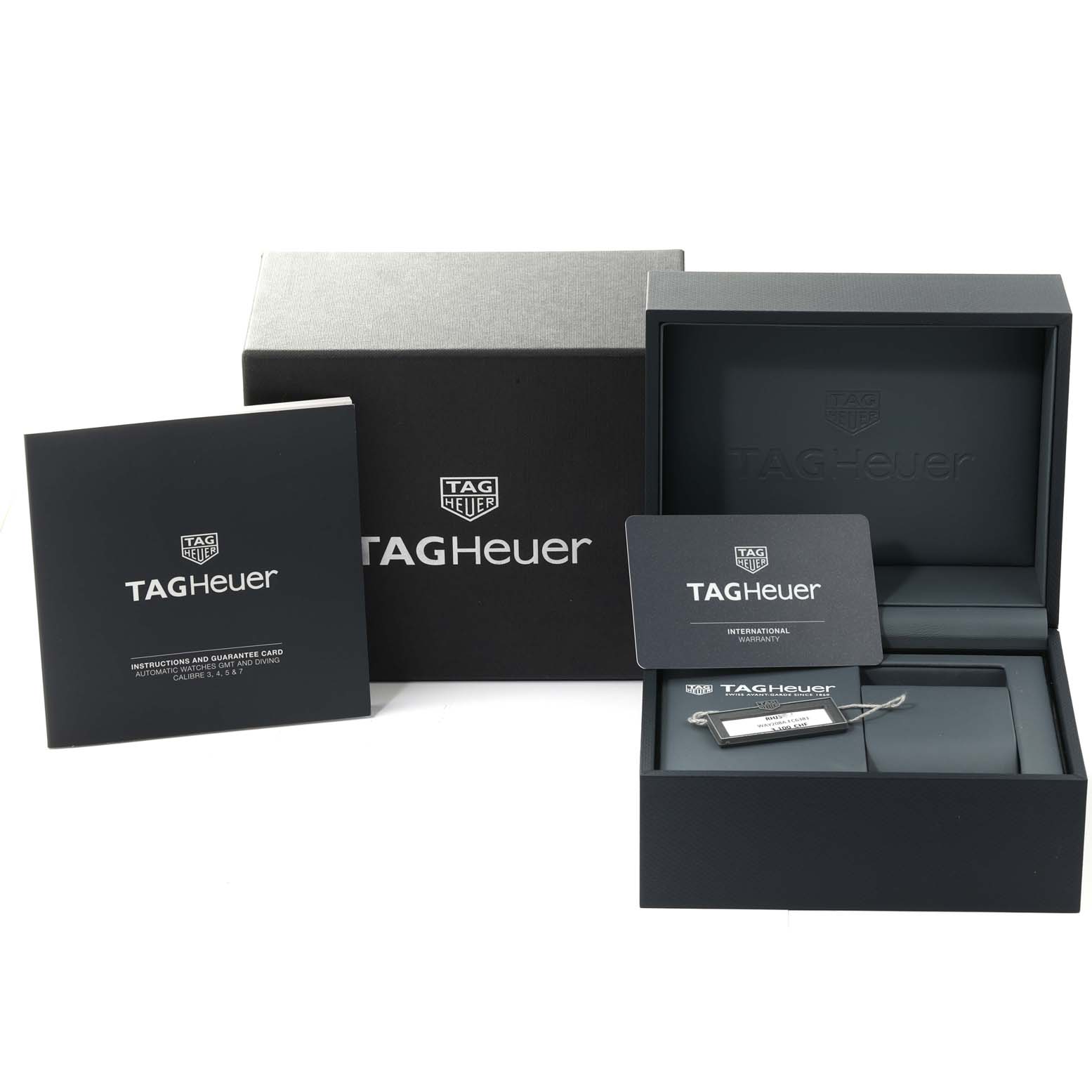 The image shows the packaging, instruction booklet, warranty card, and accessories for a Tag Heuer Aquaracer WAY208A.FC6381 Men's Titanium Black Dial WAY208A.FC6381 Men's Titanium Black Dial watch.